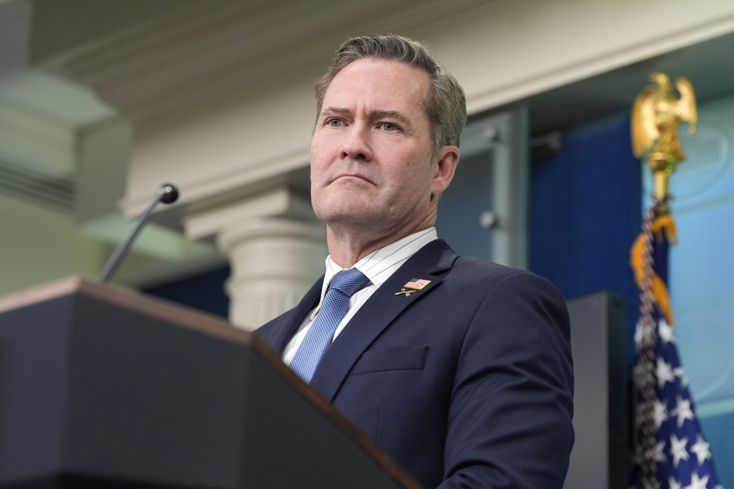 FILE - White House National Security Adviser Mike Waltz listens to a question from a reporter in th...