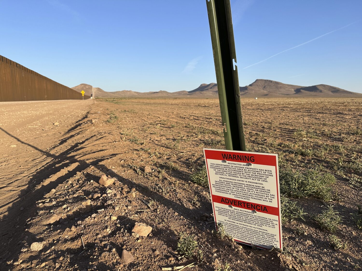 A sign warns against unauthorized entry into a militarized zone along the southern U.S. border in N...