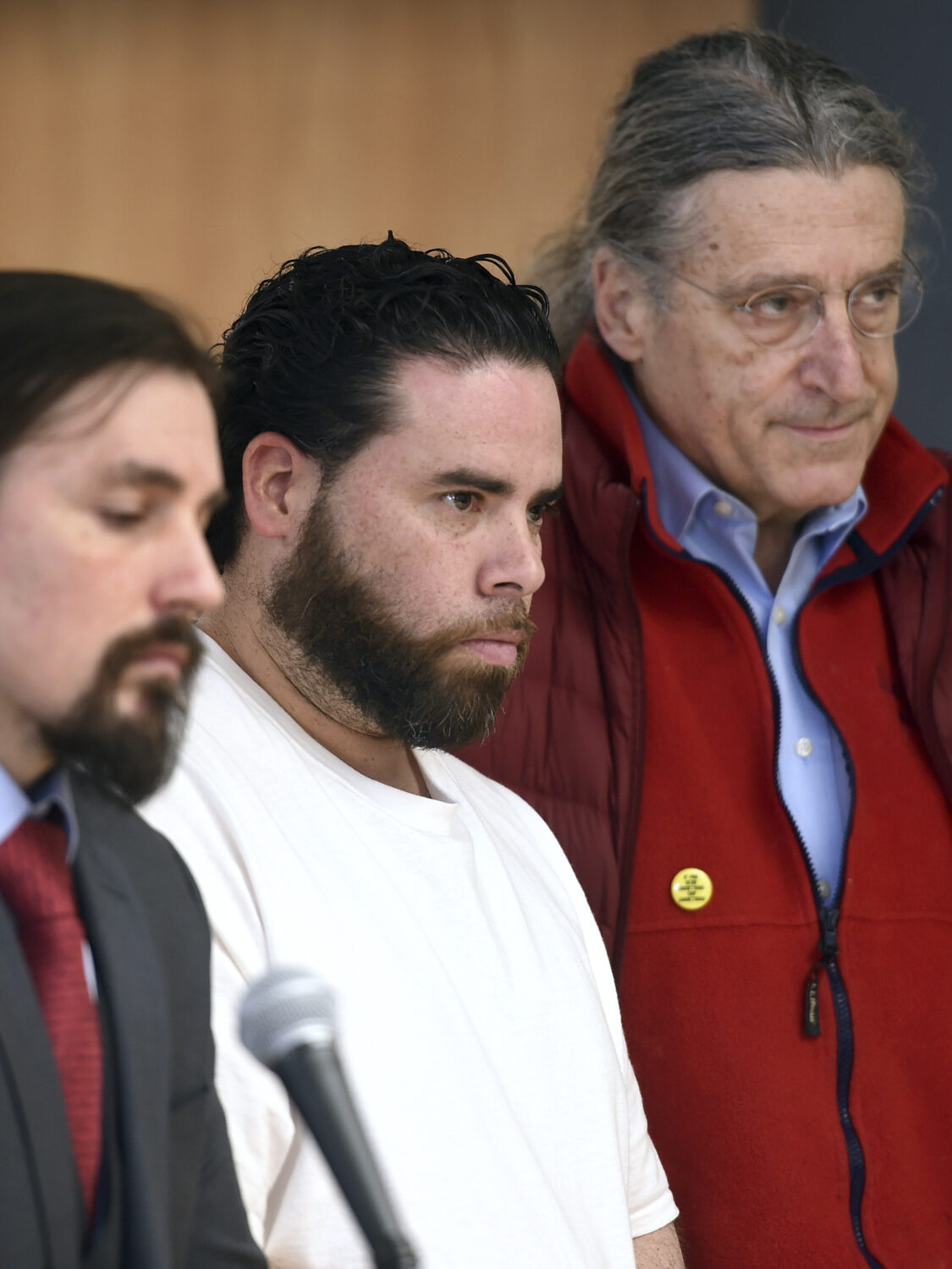 FILE - Jose Morales, center, appears for a bond hearing with attorneys Kevin Smith, left, and Norm ...