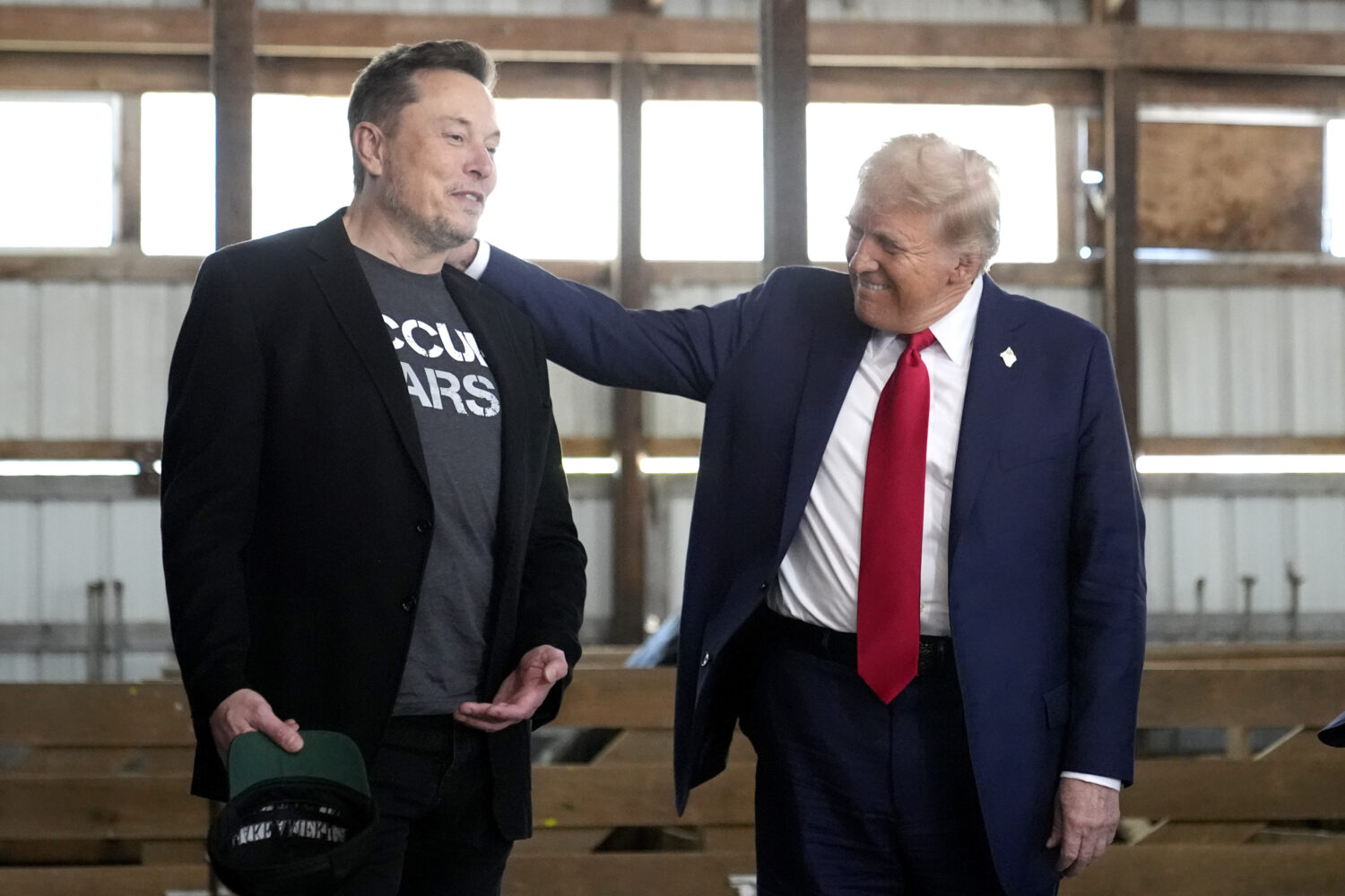 FILE - Tesla and SpaceX CEO Elon Musk, left, and Republican presidential nominee former President D...