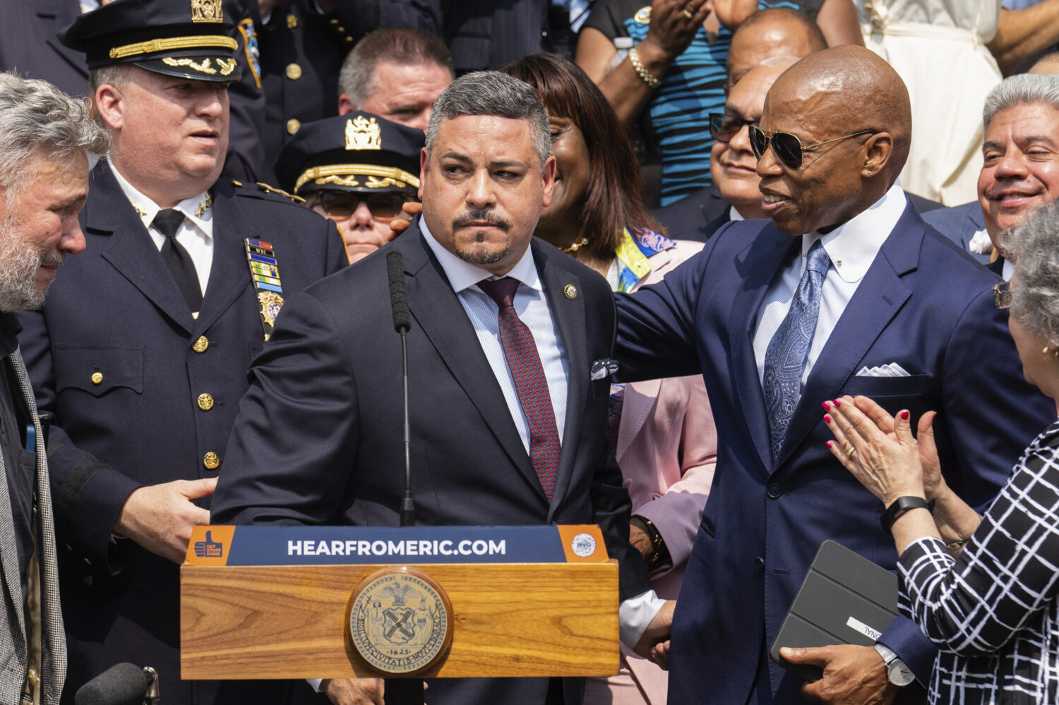 FILE - Edward A. Caban, center, speaks after being sworn in as NYPD police commissioner outside New...