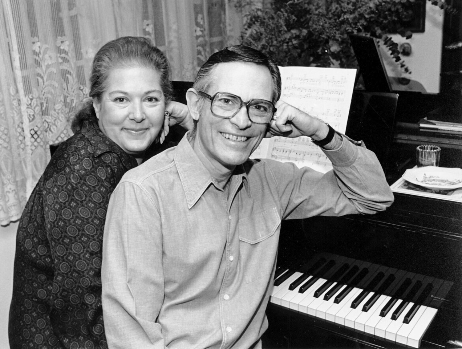FILE - Marilyn and Alan Bergman pose at their piano in their Beverly Hills home on March 17, 1980. ...