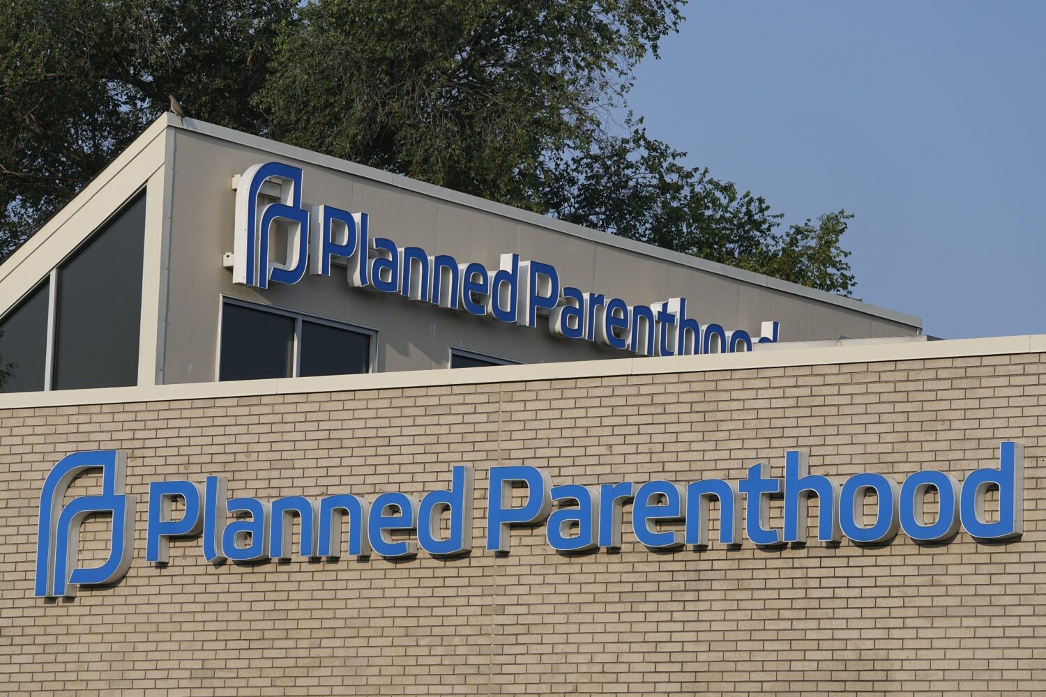FILE - A Planned Parenthood sign is displayed on the outside of the clinic, Aug. 1, 2023, in Indian...