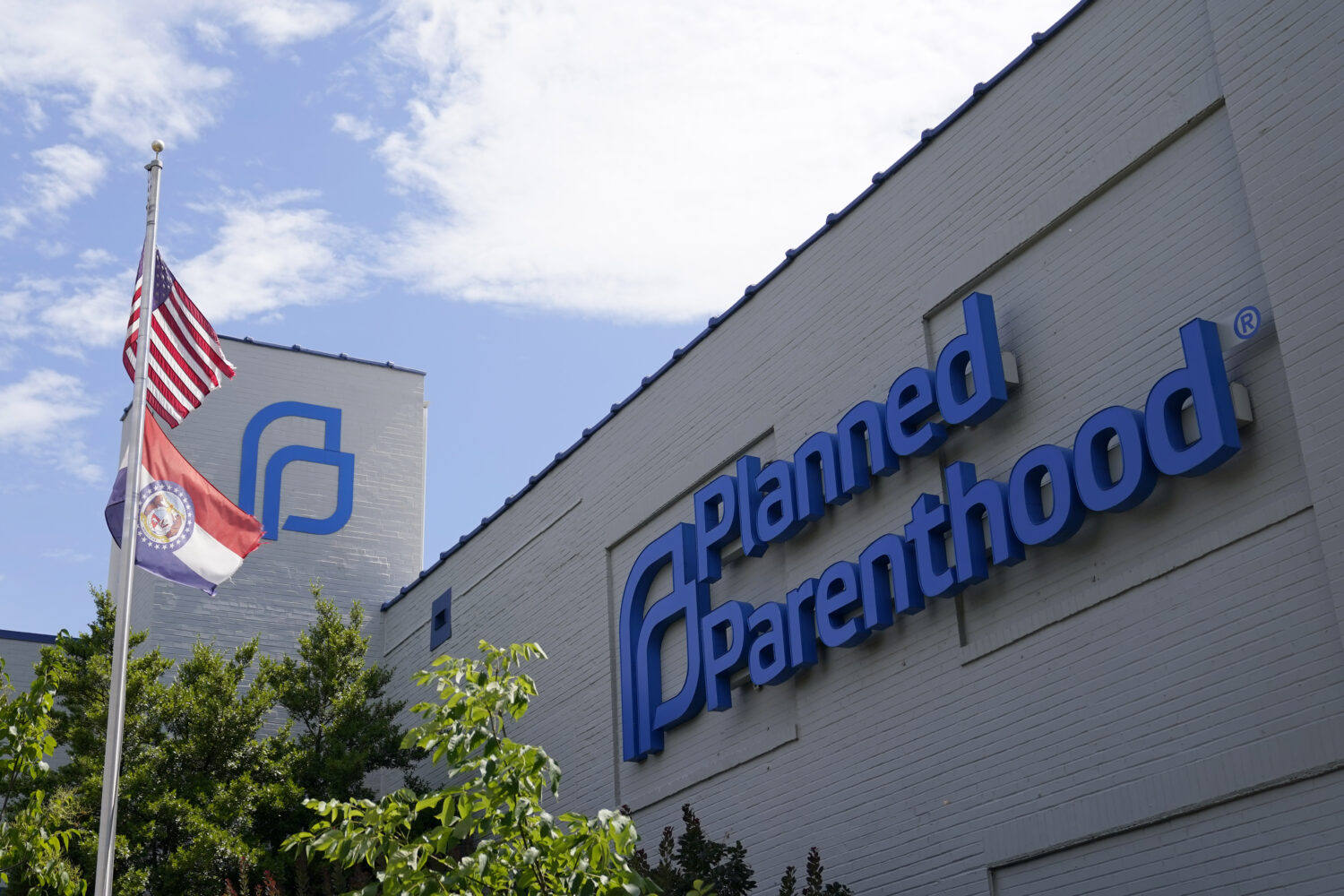 FILE - A Missouri and American flag fly outside Planned Parenthood in St. Louis, June 24, 2022. (AP...