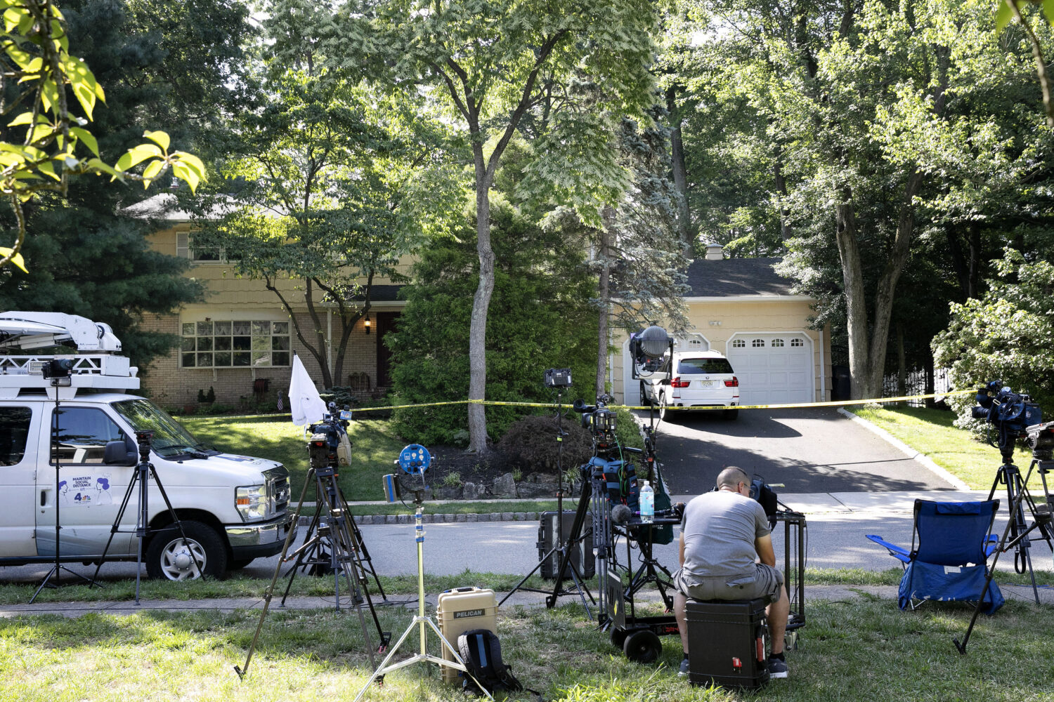 FILE - News media is set up in front of the home of U.S. District Judge Esther Salas, July 20, 2020...