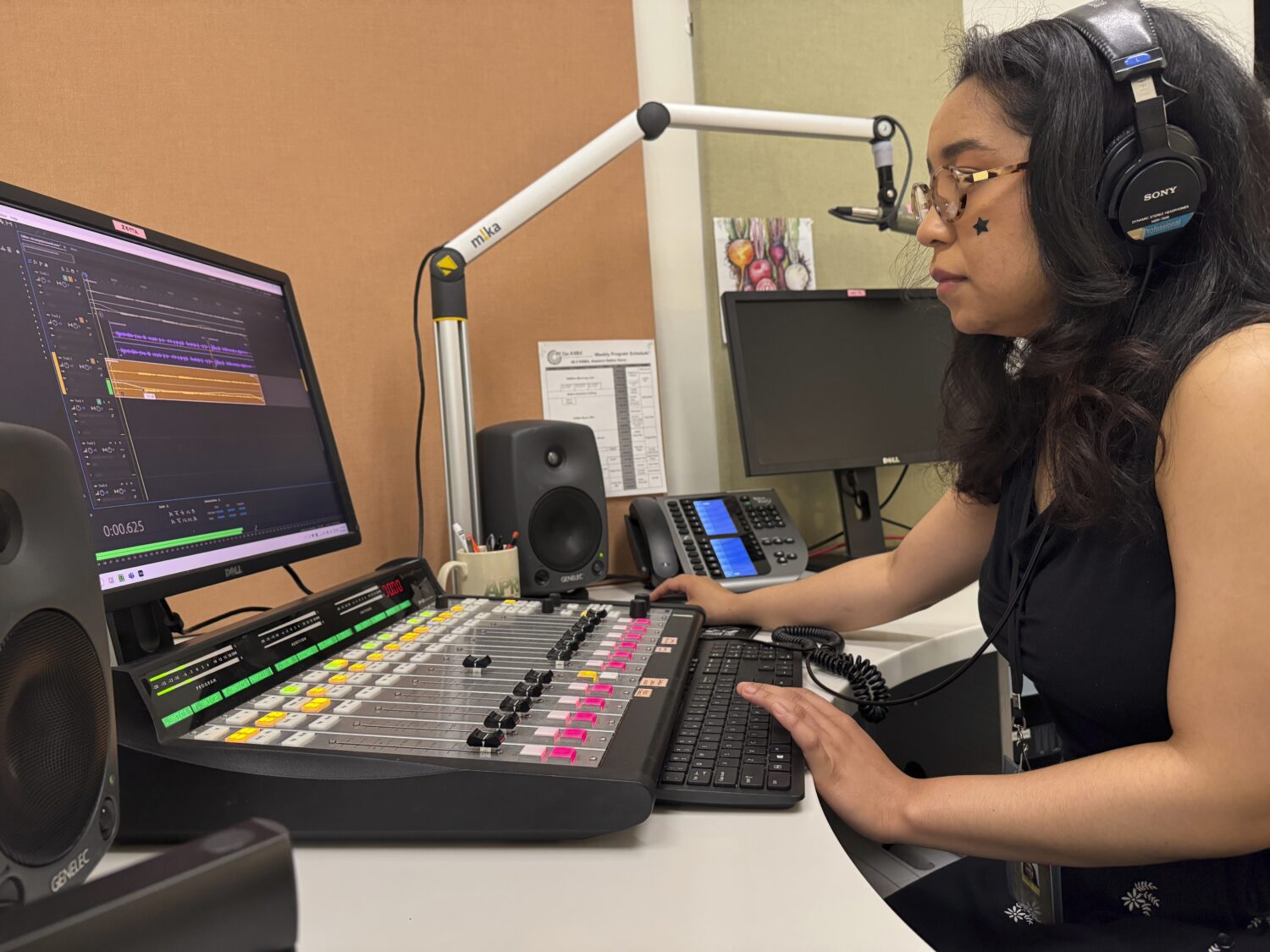 Elayna Cunningham, a college student interning at Koahnic Broadcast Corp., records a program on Jul...
