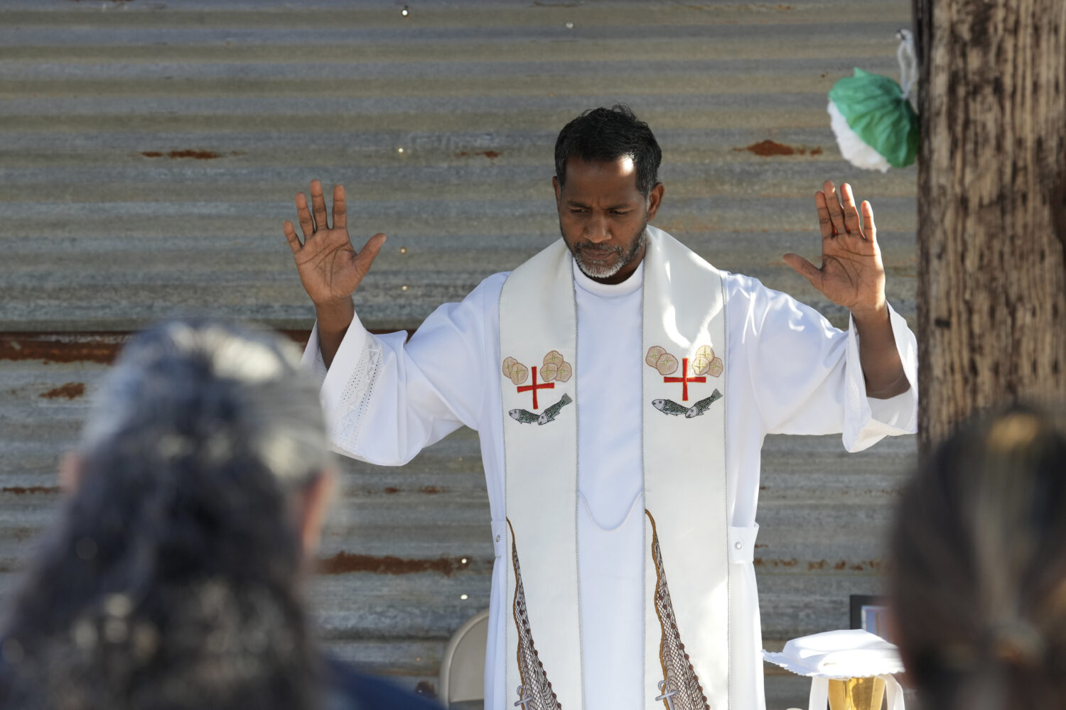 The Rev. Aro Varnabas starts the St. John the Baptist's feast day Mass in Saguaro National Park nea...