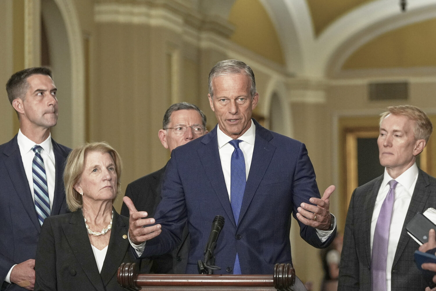 Sen. Majority Leader John Thune, R-S.D., center, speaks during a news conference after a policy lun...