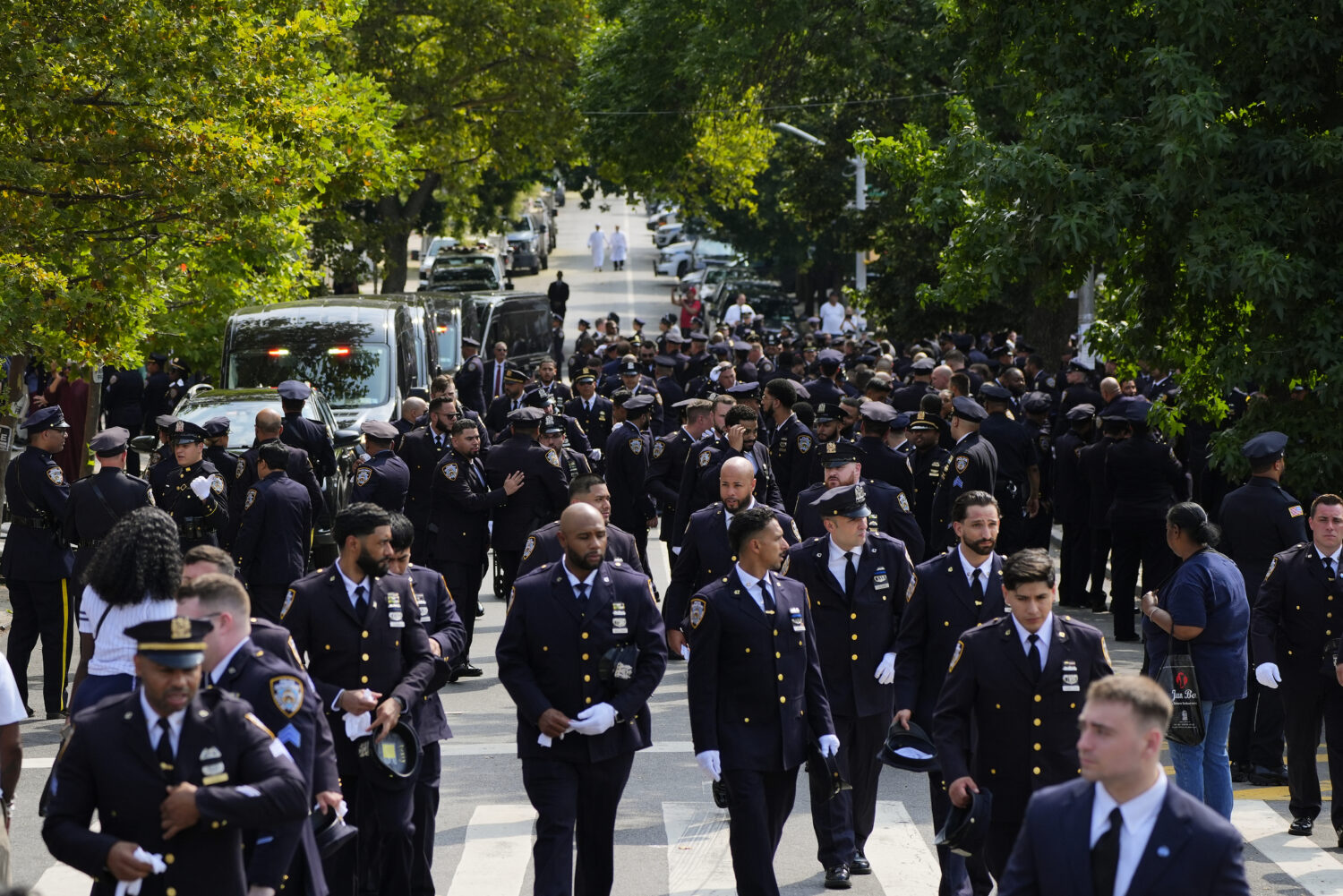 New York Police officers gather outside the Parkchester Jame Masjid mosque for the funeral of offic...