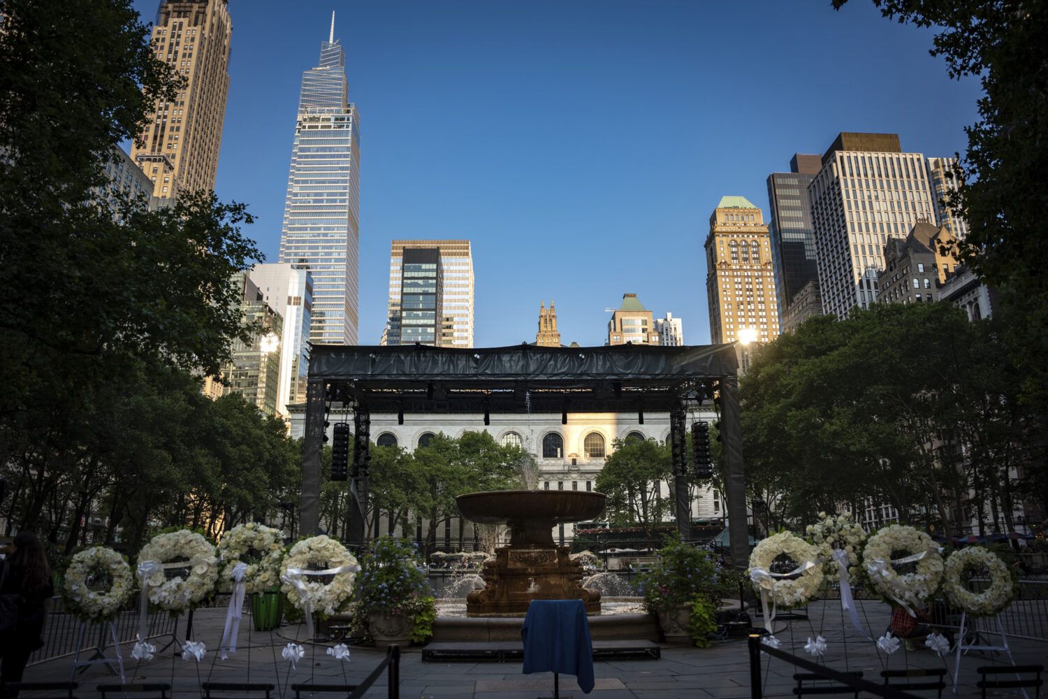 Flower wreaths with the words "Rest In Peace" stand at a vigil for the four people killed in the pr...