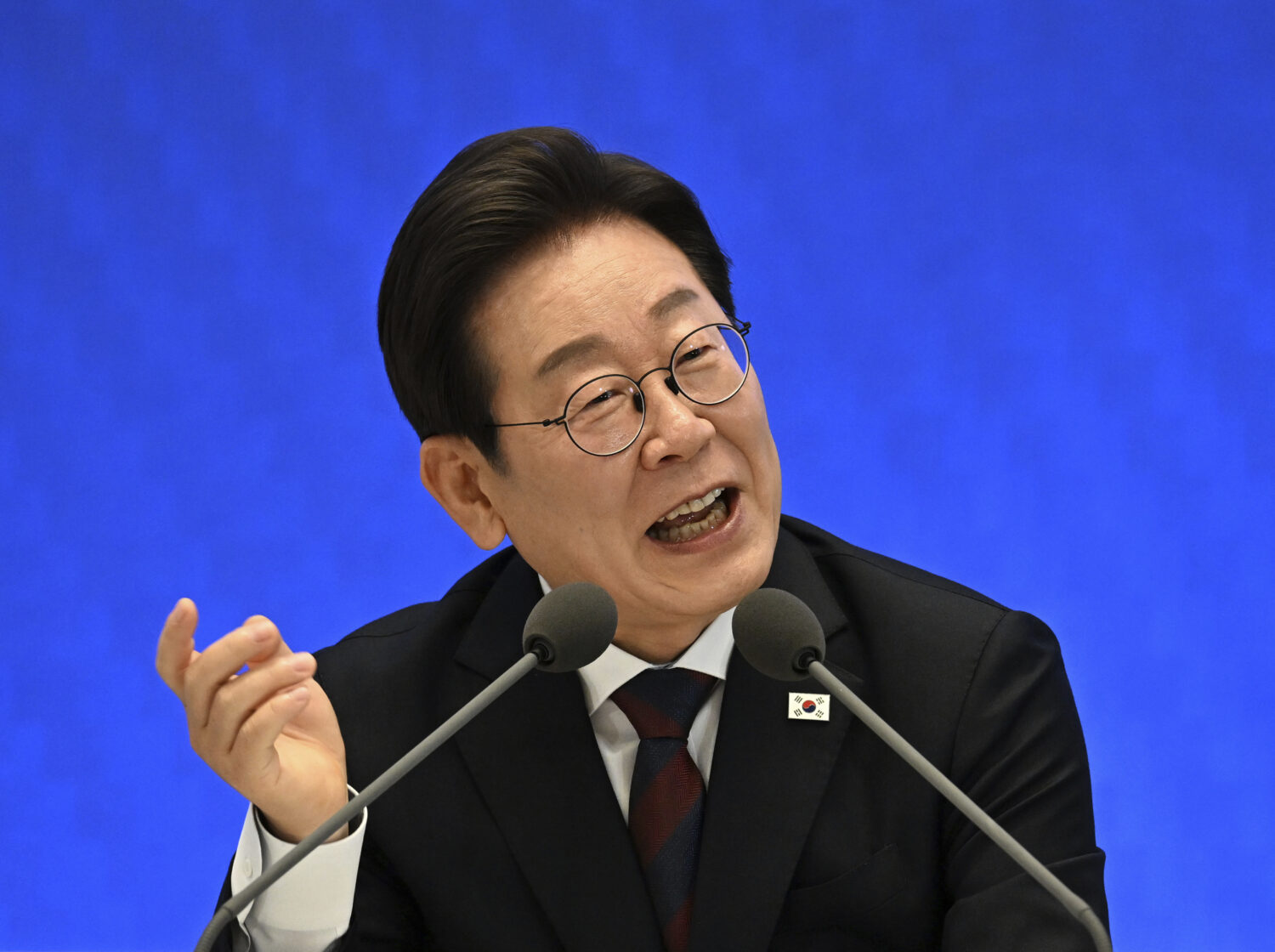 South Korean President Lee Jae-myung delivers a speech during a news conference to mark his first 3...