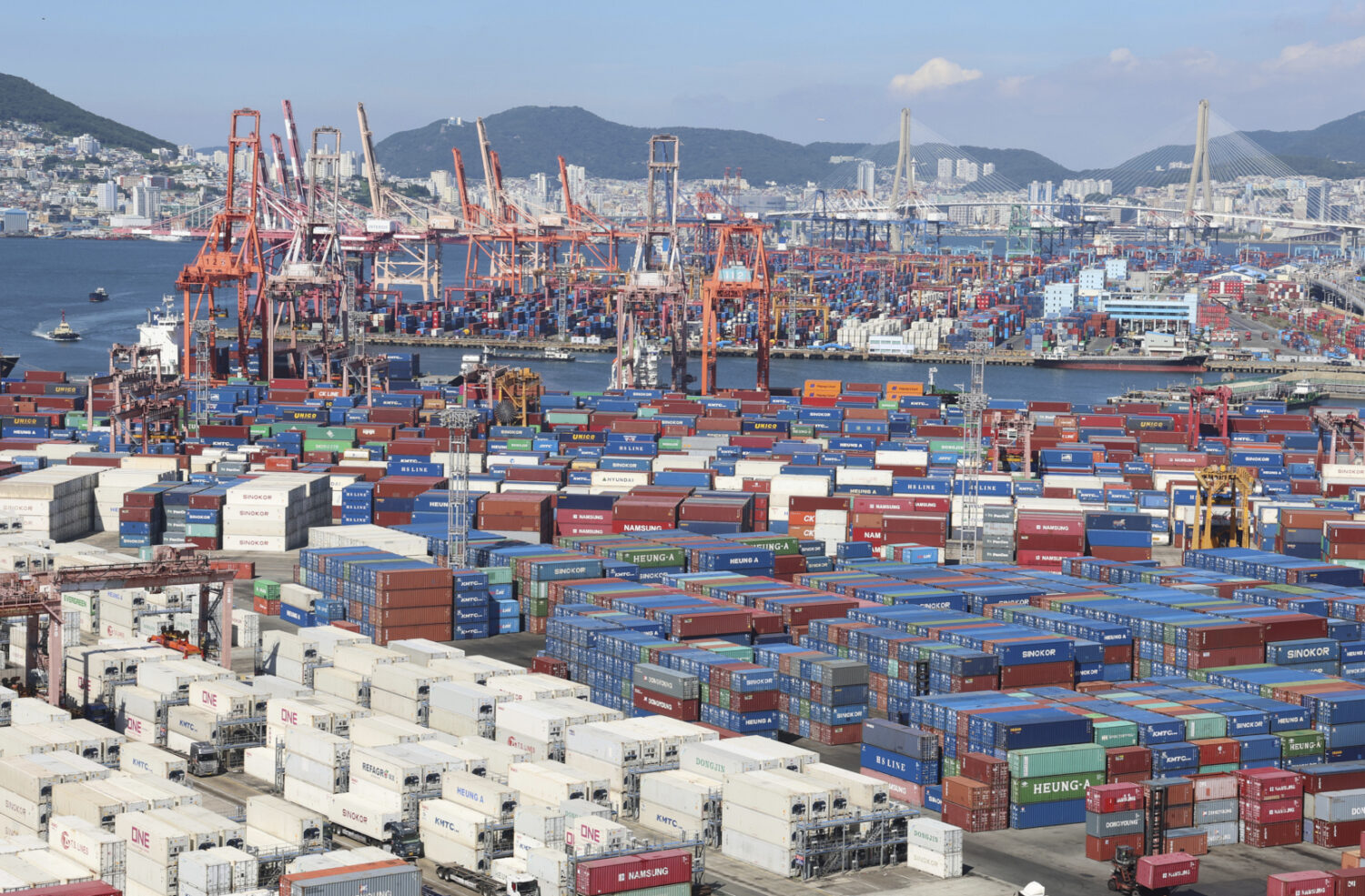 Cranes and shipping containers are seen at a port in Busan, South Korea, Thursday, July 31, 2025. (...