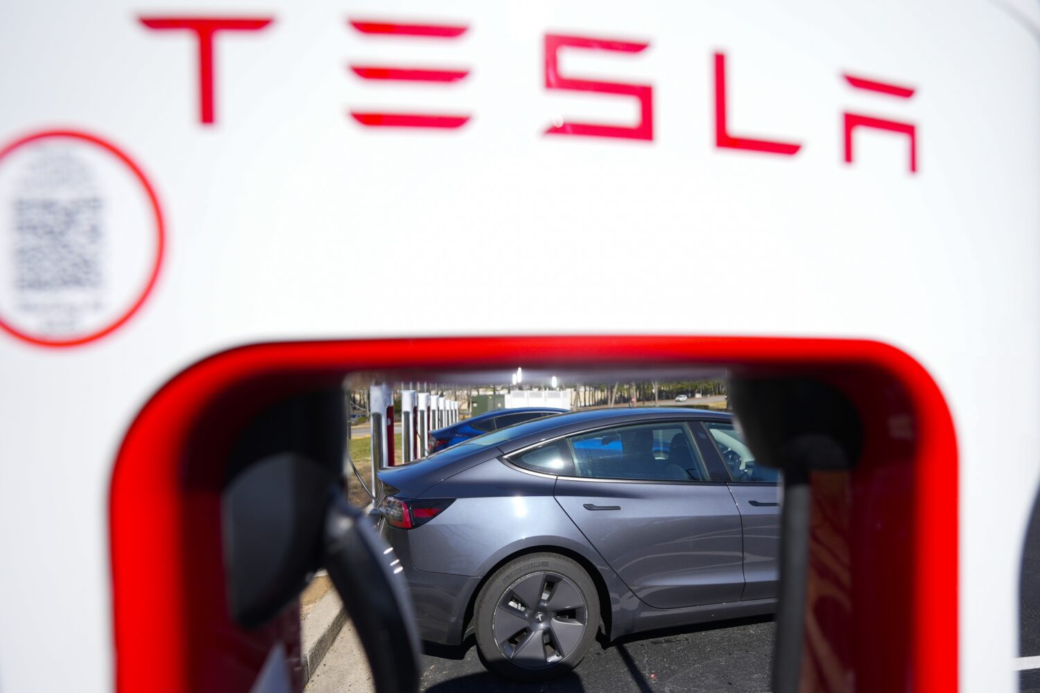 FILE - A Tesla level three Electric vehicle charger is visible, Feb. 2, 2024, in Kennesaw, Ga., nea...