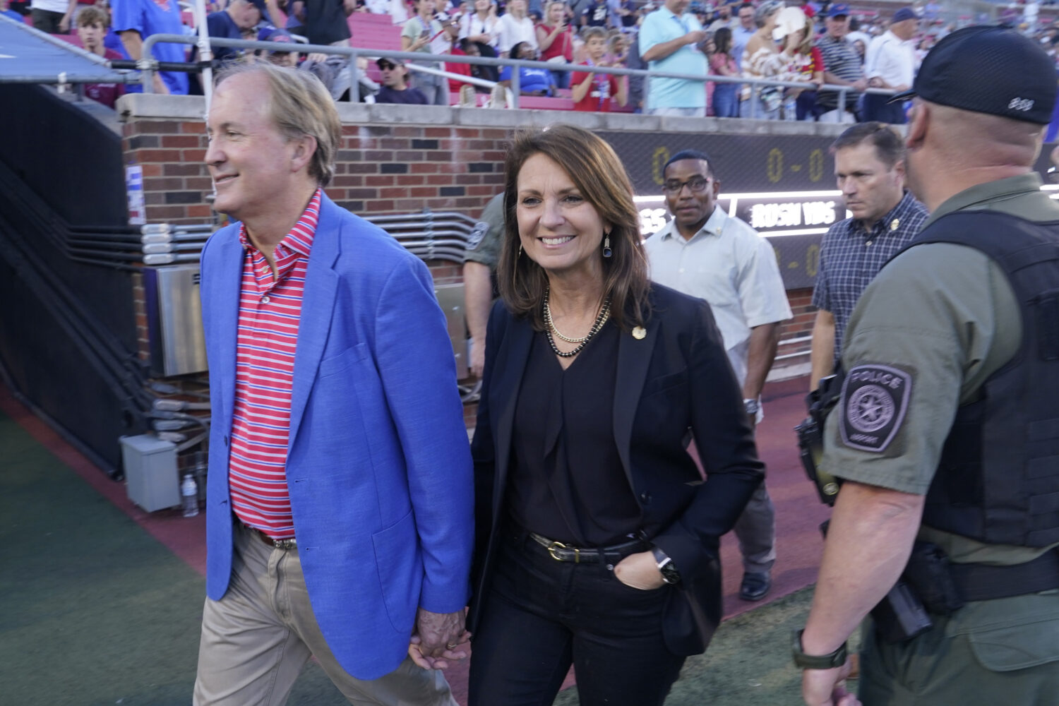 FILE - Texas Attorney General Ken Paxton, left, walks with his wife and Texas State Sen. Angela Pax...