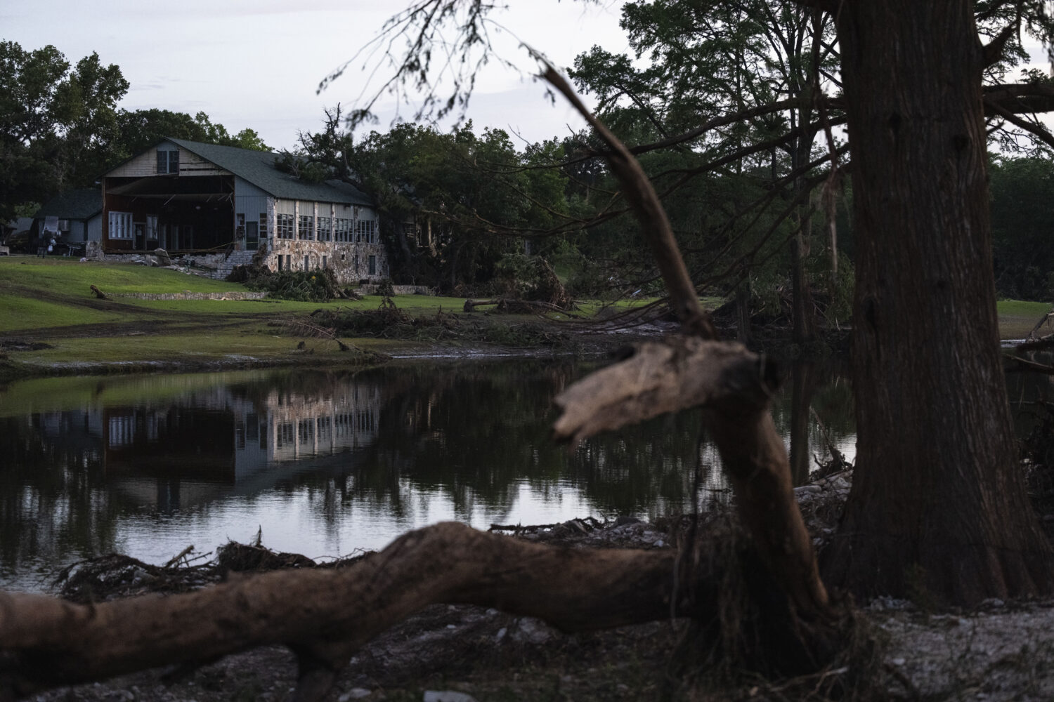 Camp Mystic stands next a creek that feeds into the Guadalupe River, Monday, July 7, 2025, in Hunt,...