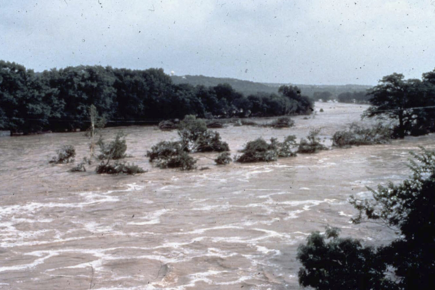 This photo provided by the National Weather Service shows flooding in the Guadalupe River in Texas ...