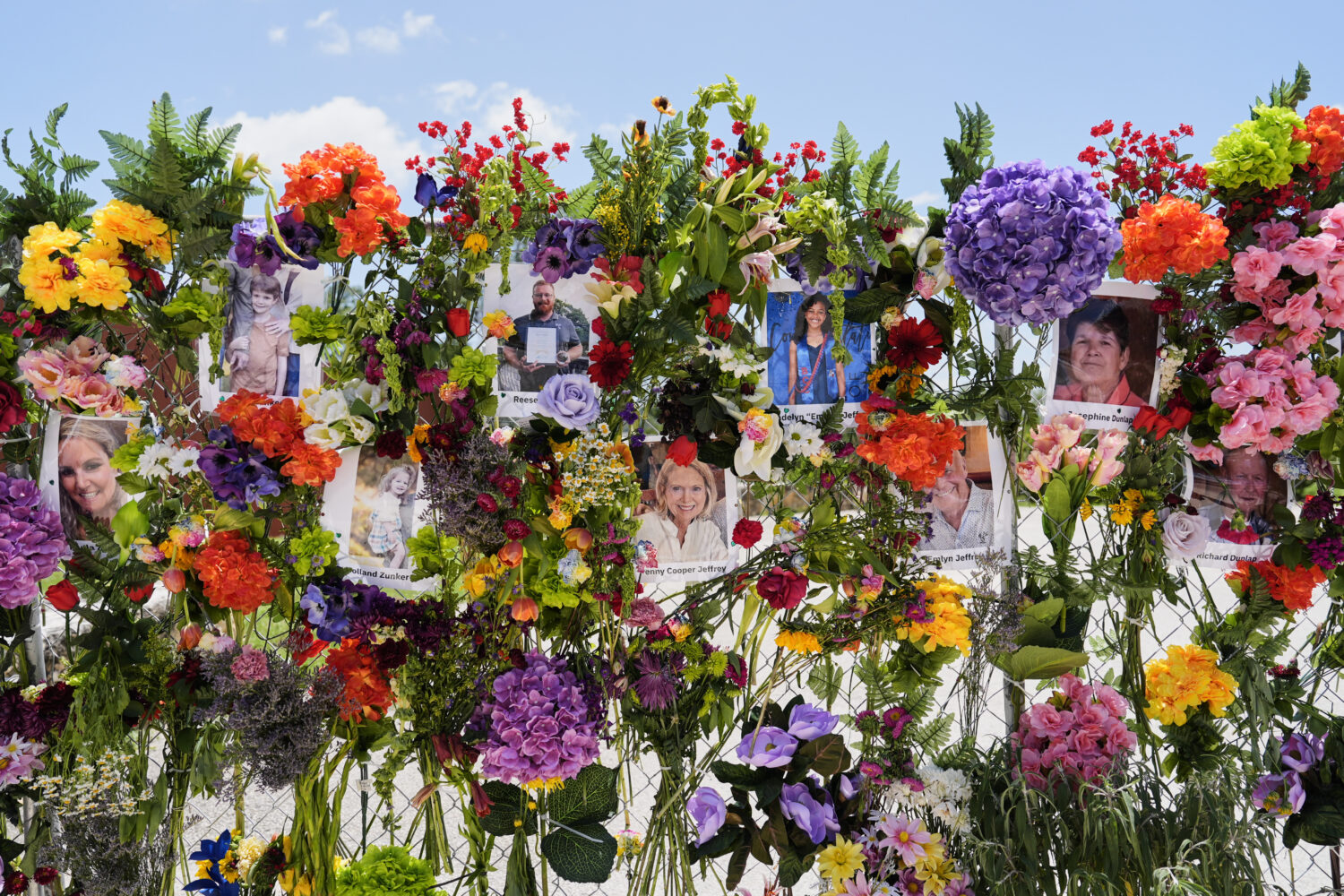 Photographs of flood victims are displayed on a memorial wall in Kerrville, Texas, Thursday, July 1...