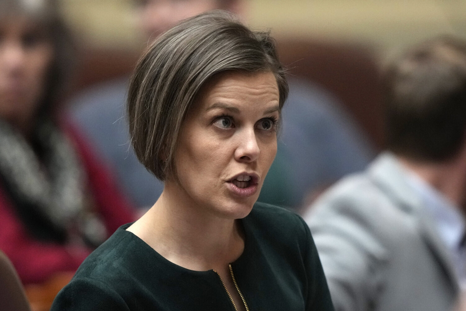 FILE - State Rep. Laurel Libby, R-Auburn, speaks with a colleague, Feb. 14, 2023, at the State Hous...