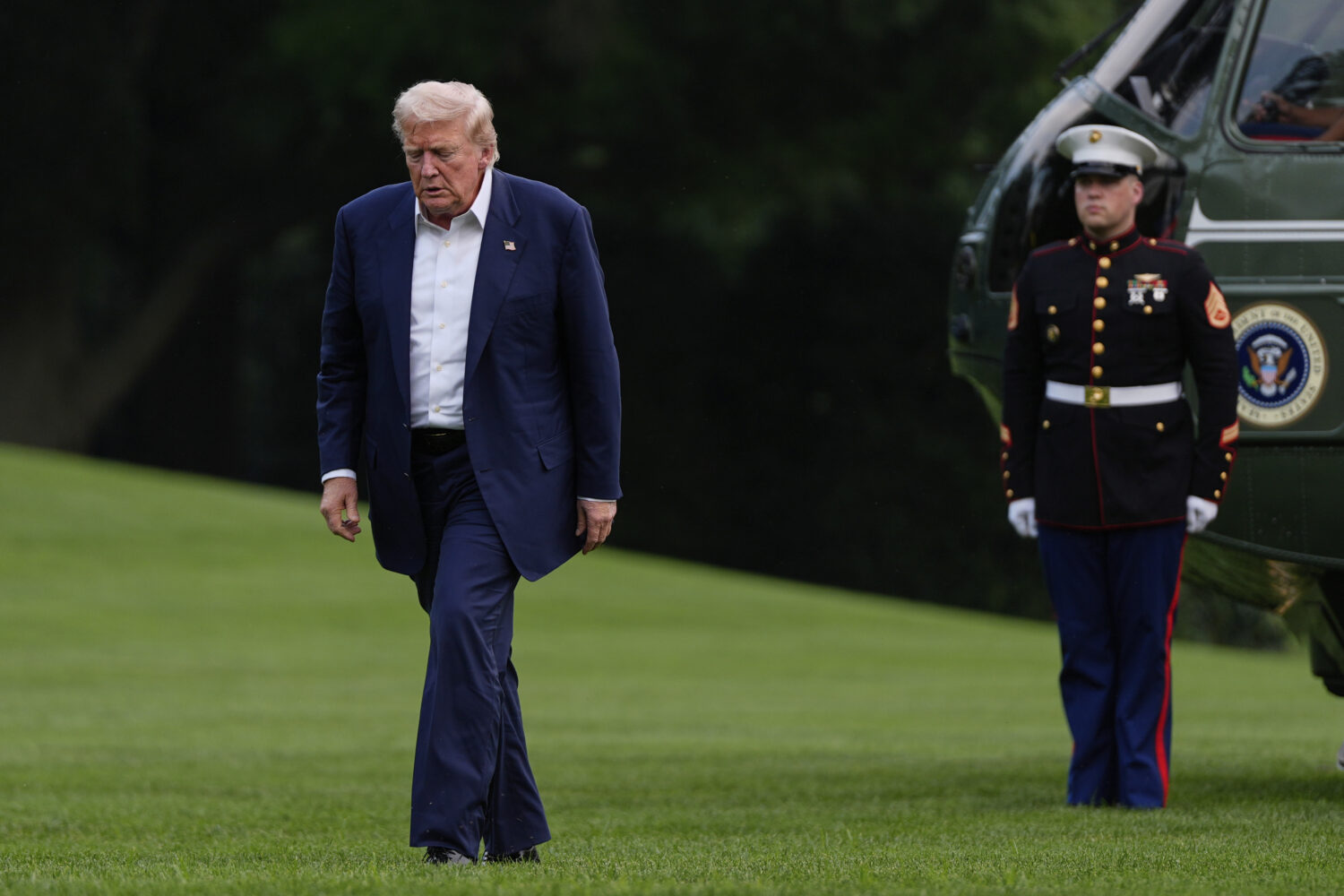 President Donald Trump walks from Marine One after arriving on the South Lawn of the White House, T...