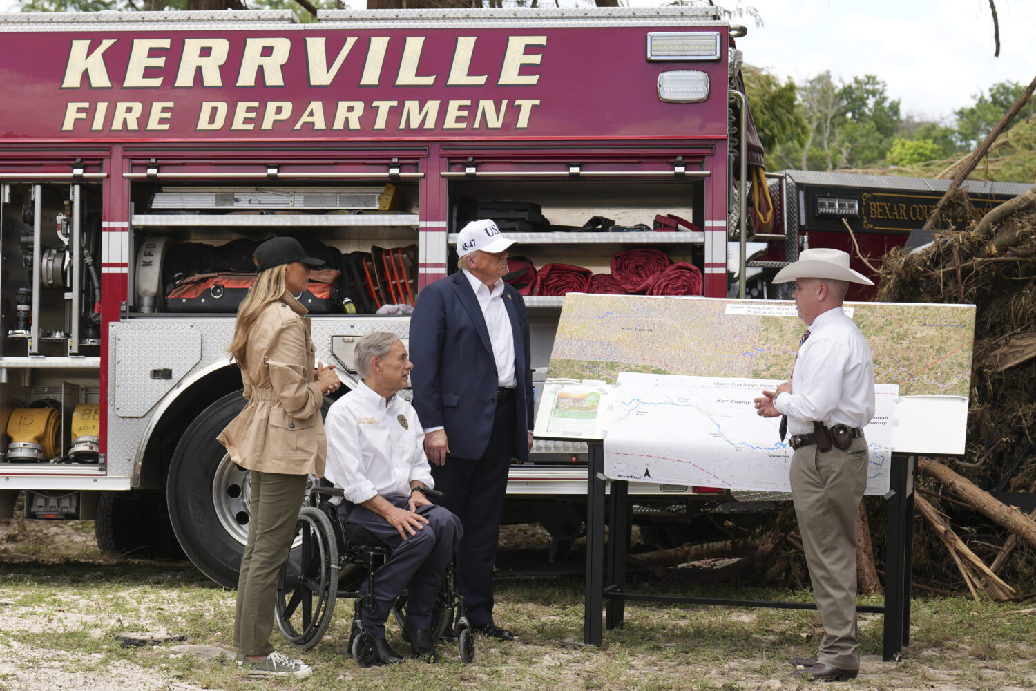 First lady Melania Trump, from left, Texas Gov. Greg Abbott and President Donald Trump are briefed ...