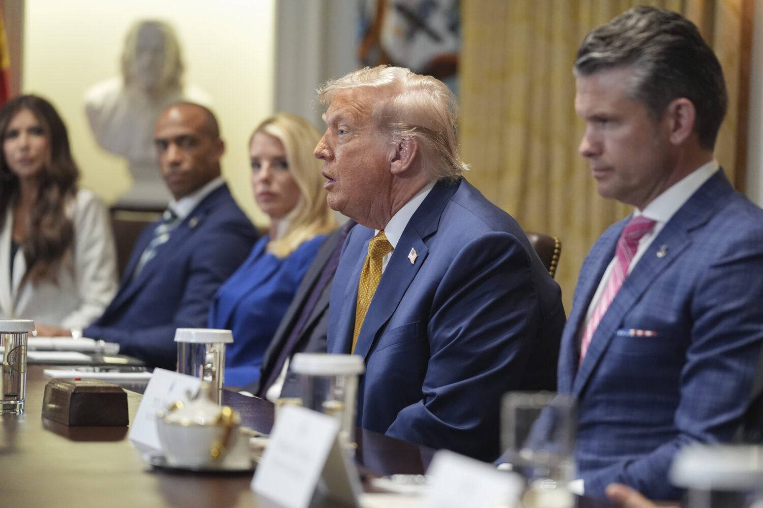 President Donald Trump, center, speaking during a cabinet meeting with from l-r., Homeland Security...