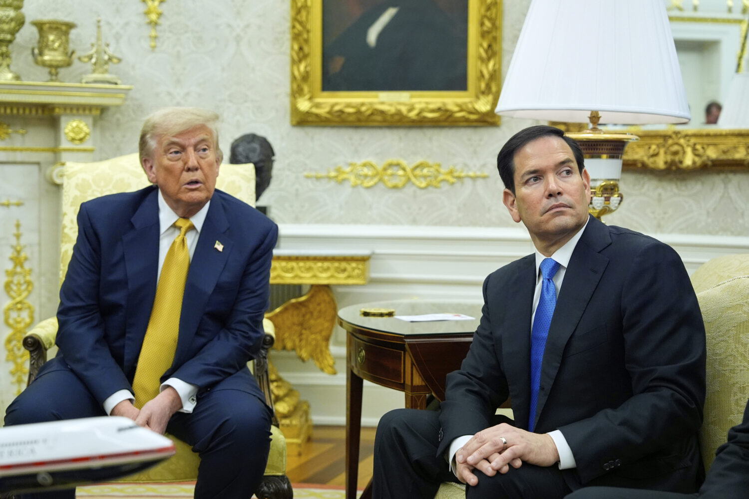 President Donald Trump and Secretary of State Marco Rubio listen during a meeting with Bahrain's Cr...