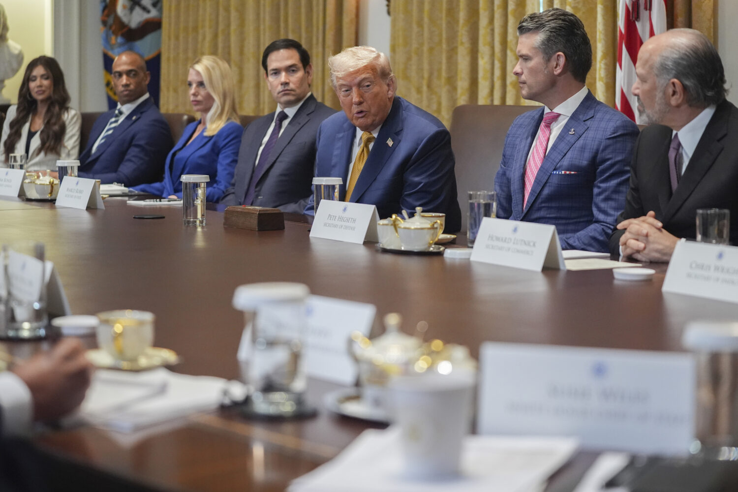 President Donald Trump, center, speaking during a cabinet meeting with from l-r., Homeland Security...
