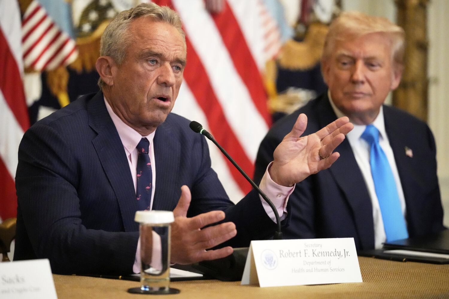 Health and Human Services Secretary Robert F. Kennedy Jr. speaks as President Donald Trump listens ...