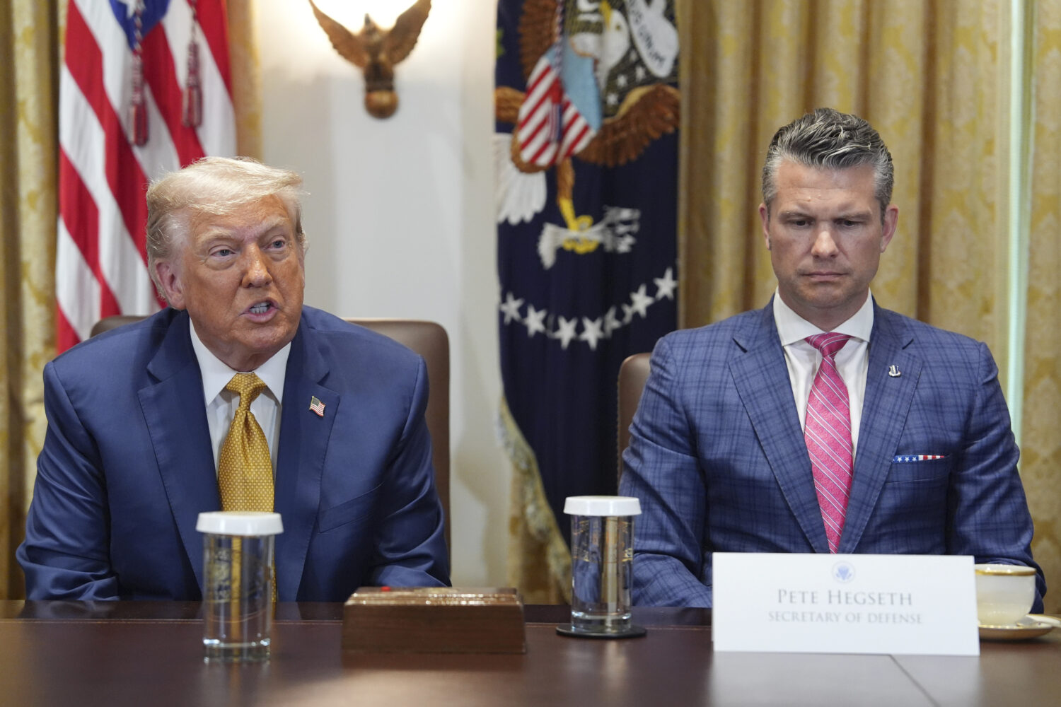President Donald Trump, left, with Defense Secretary Pete Hegseth, right, during a cabinet meeting ...