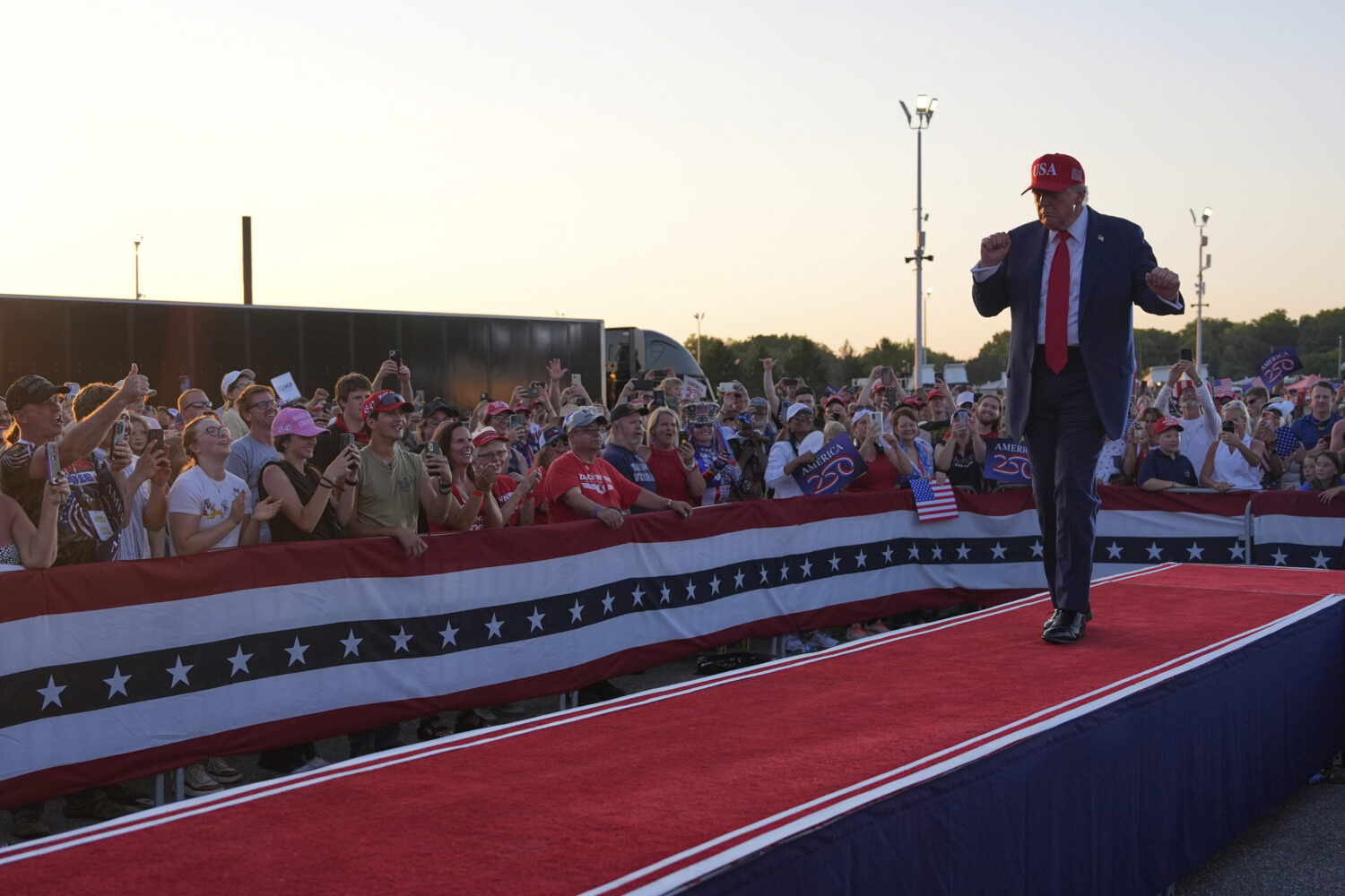 President Donald Trump dances after speaking at a rally at the Iowa State Fairgrounds, Thursday, Ju...