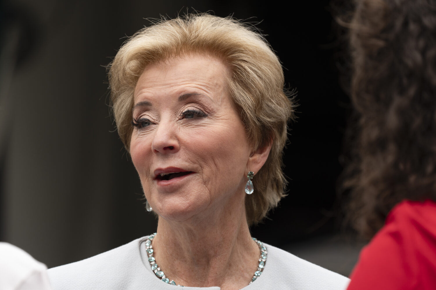 Education Secretary Linda McMahon, talks to her staff as they wait on the North Lawn of the White H...