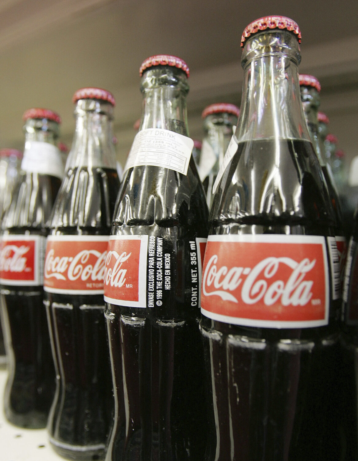 FILE - Bottles of Mexican Coca-Cola fill a prominent spot on the shelves of the Tarascas Latino Sup...
