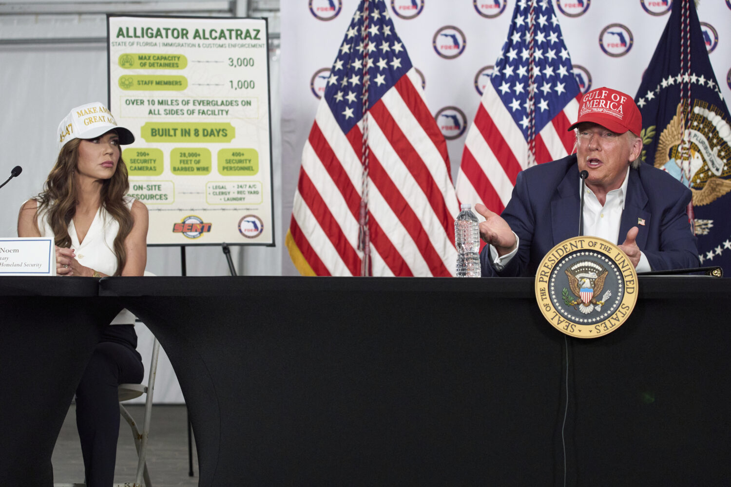 Homeland Security Secretary Kristi Noem listens as President Donald Trump speaks during a roundtabl...