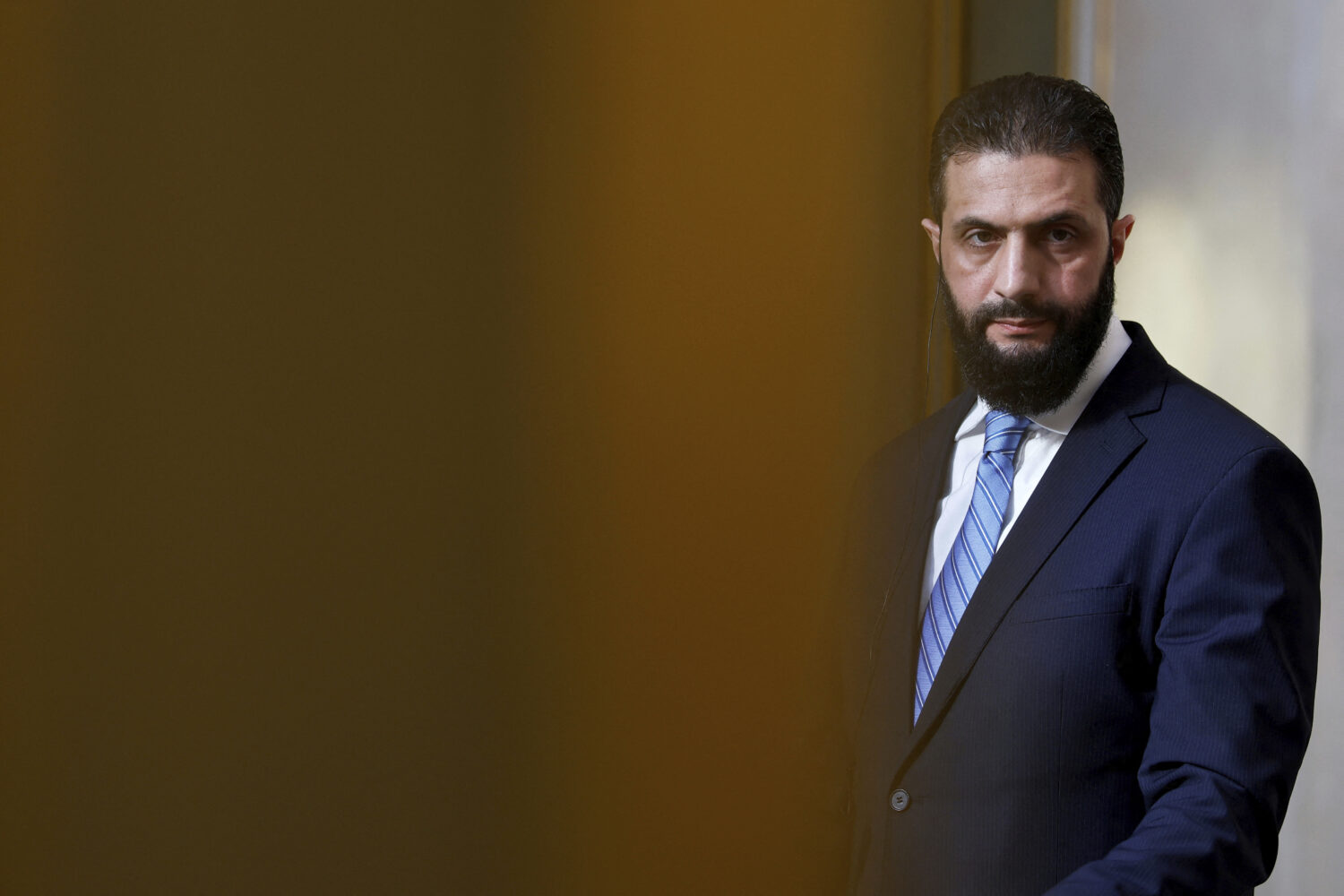 FILE - Syria's interim president, Ahmad al-Sharaa, listens during a press conference in Paris, May ...
