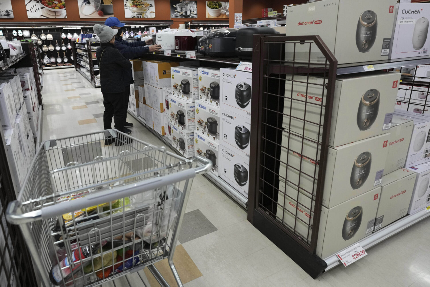 FILE - Shoppers shop electric rice cookers imported from Japan and Korea at the H Mart in Niles, Il...