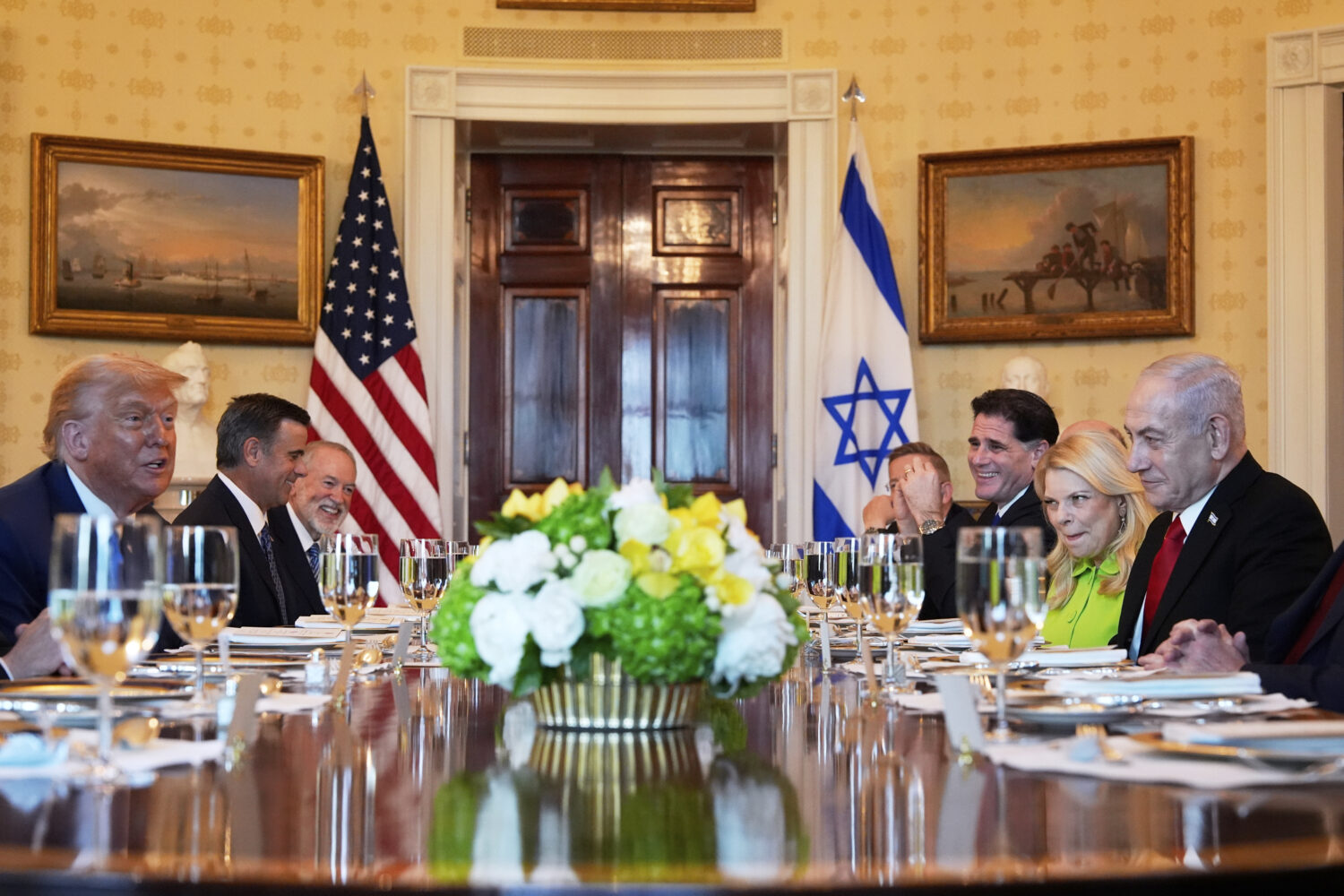 President Donald Trump, left, meets with Israel's Prime Minister Benjamin Netanyahu, right, as CIA ...
