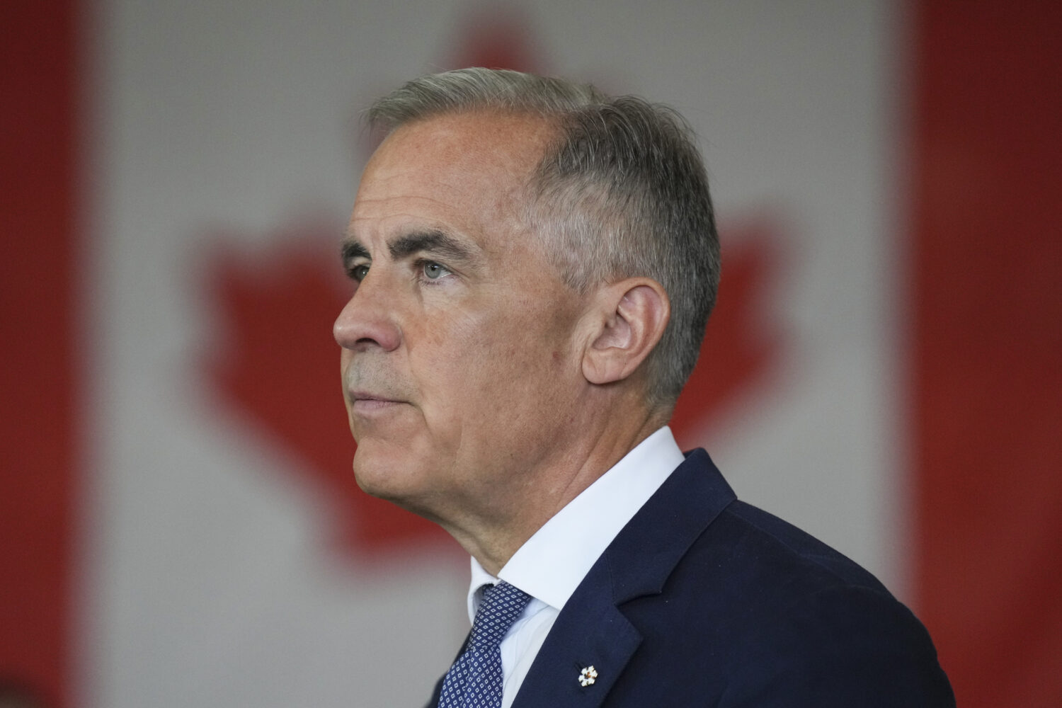 Canada's Prime Minister Mark Carney delivers a statement at the Walters Group Steel fabrication pla...
