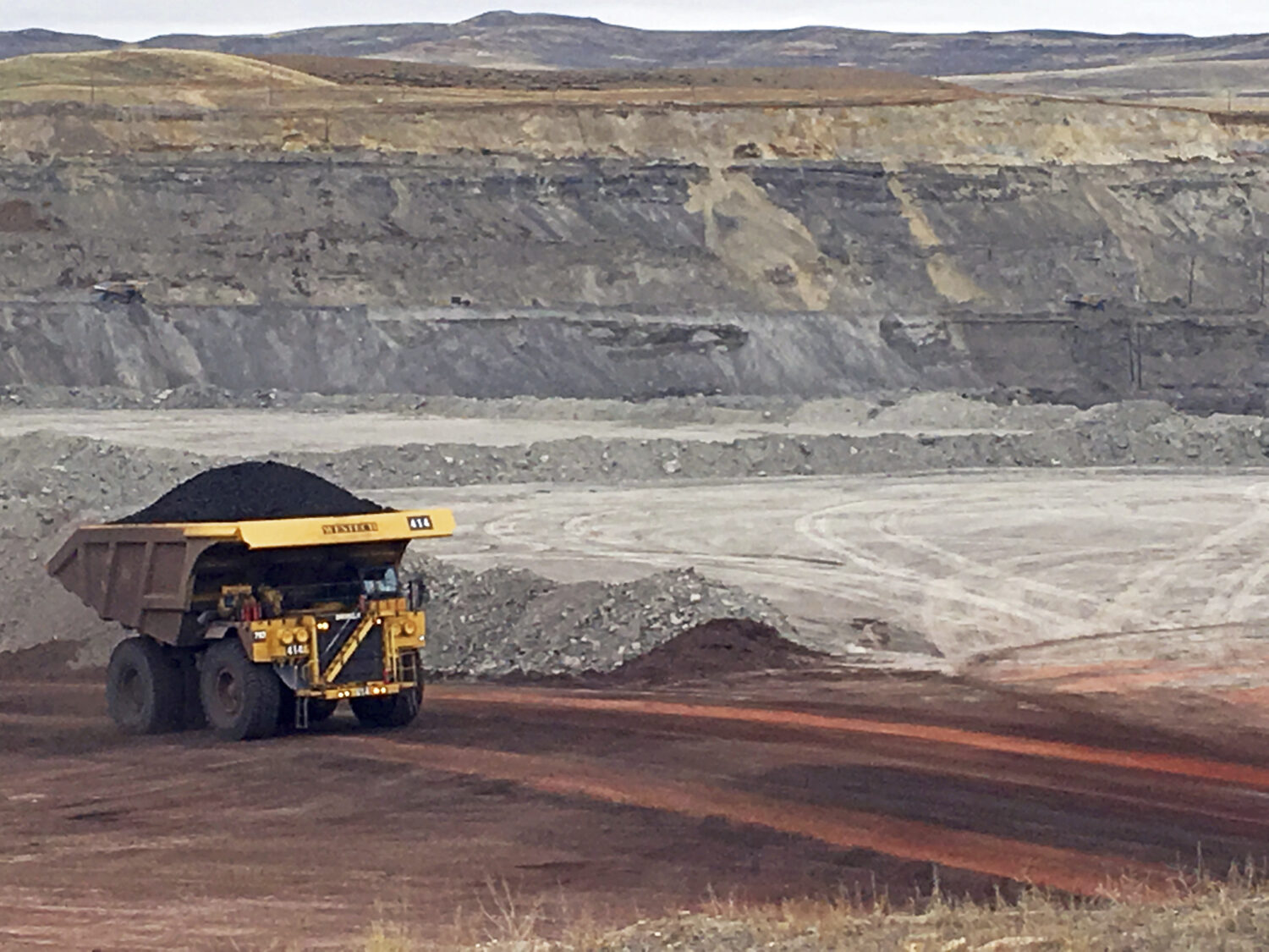FILE - A dump truck hauls coal at Contura Energy's Eagle Butte Mine near Gillette, Wyo., March 28, ...