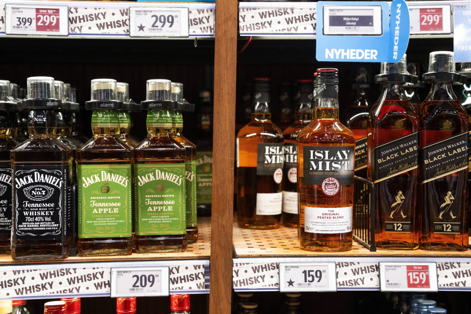 FILE - Bottles of spirits are labeled with a star in Bilka in Randers, Denmark, making it easier fo...