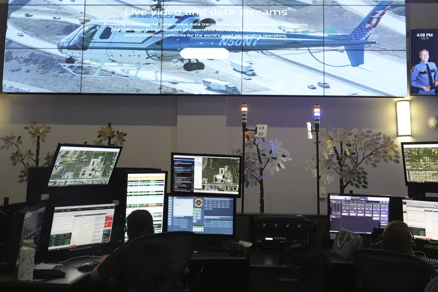 Dispatchers work emergency calls at the Collier County Emergency Services Center, Friday, July 11, ...