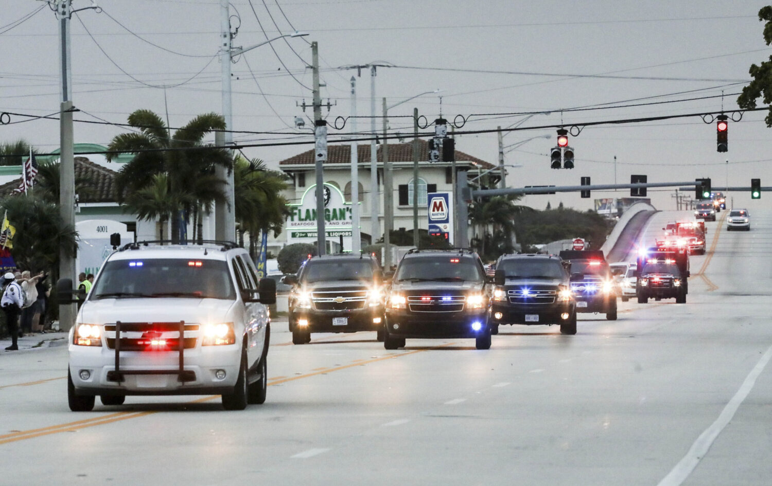 FILE - President Donald Trump's motorcade heads east on Southern Blvd. from Palm Beach Internationa...