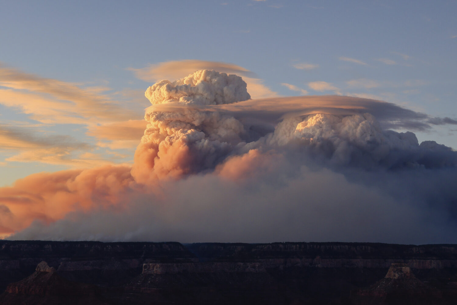 In this photo provided by Lin Chao, 'fire clouds' form near the Bright Angel Trailhead at the South...