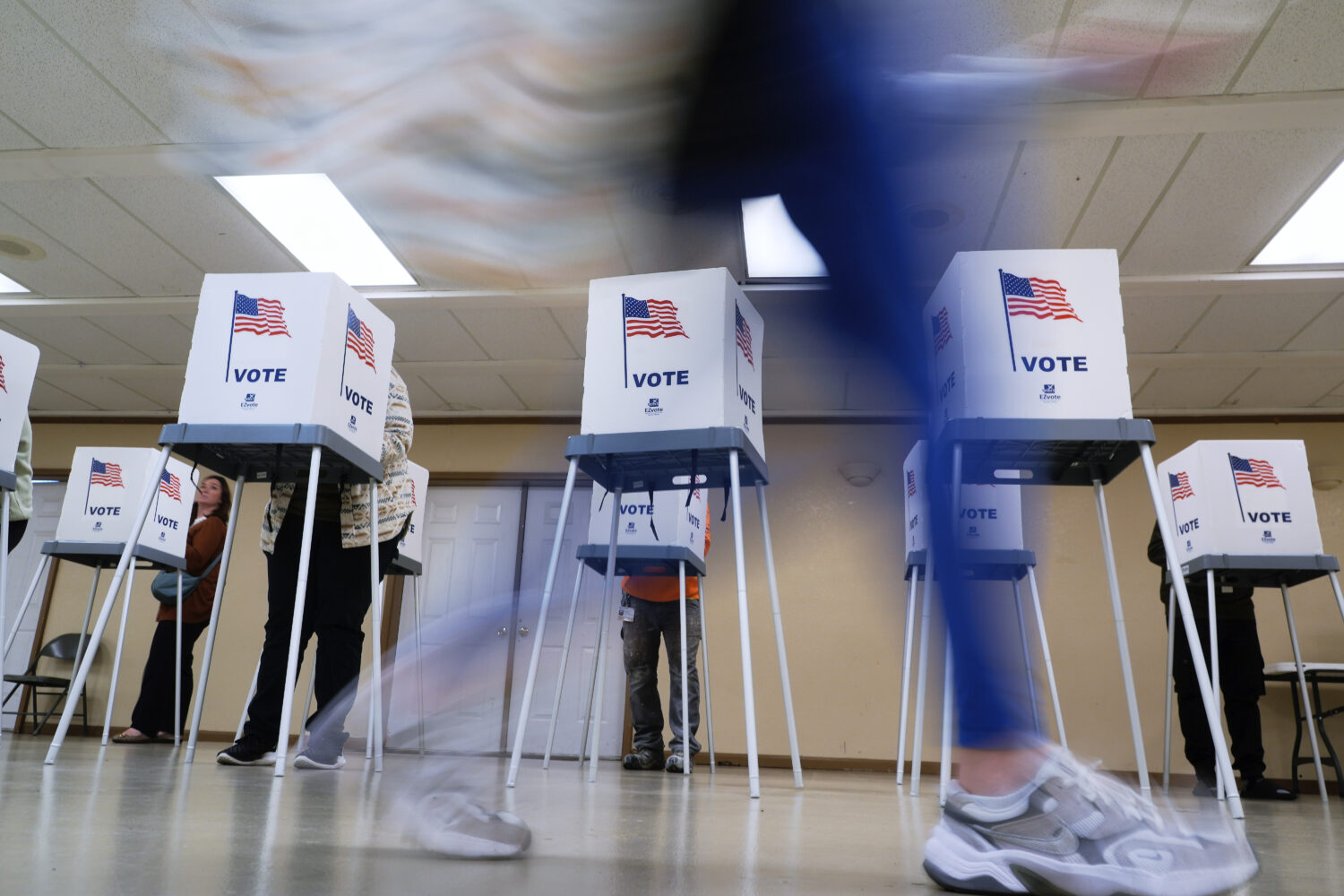 FILE - People vote, Nov. 5, 2024, in Oak Creek, Wis. (AP Photo/Morry Gash, File)Credit: ASSOCIATED ...