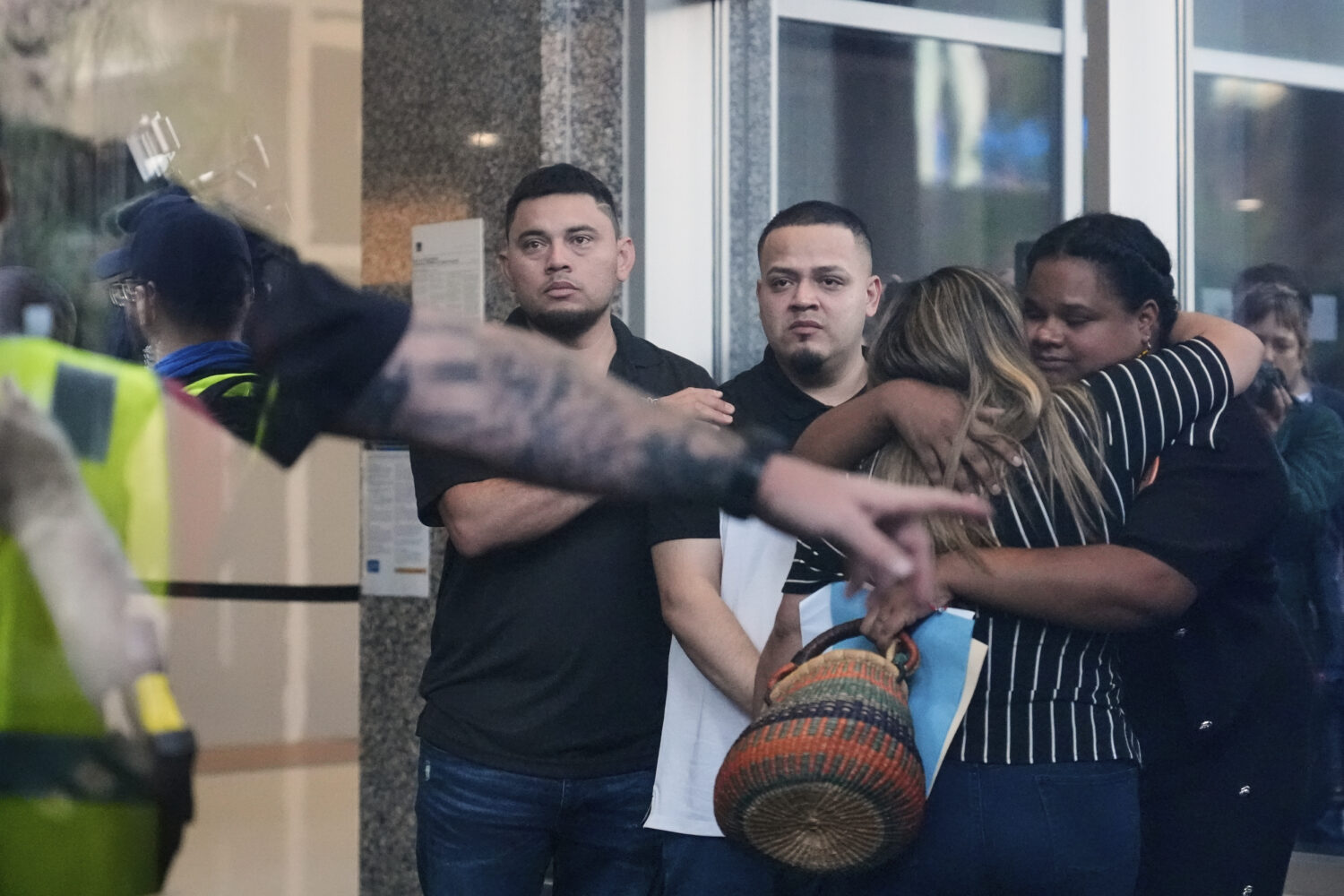 Kilmar Abrego Garcia, center, and his brother Cesar Abrego Garcia, left, arrive at the Immigration ...
