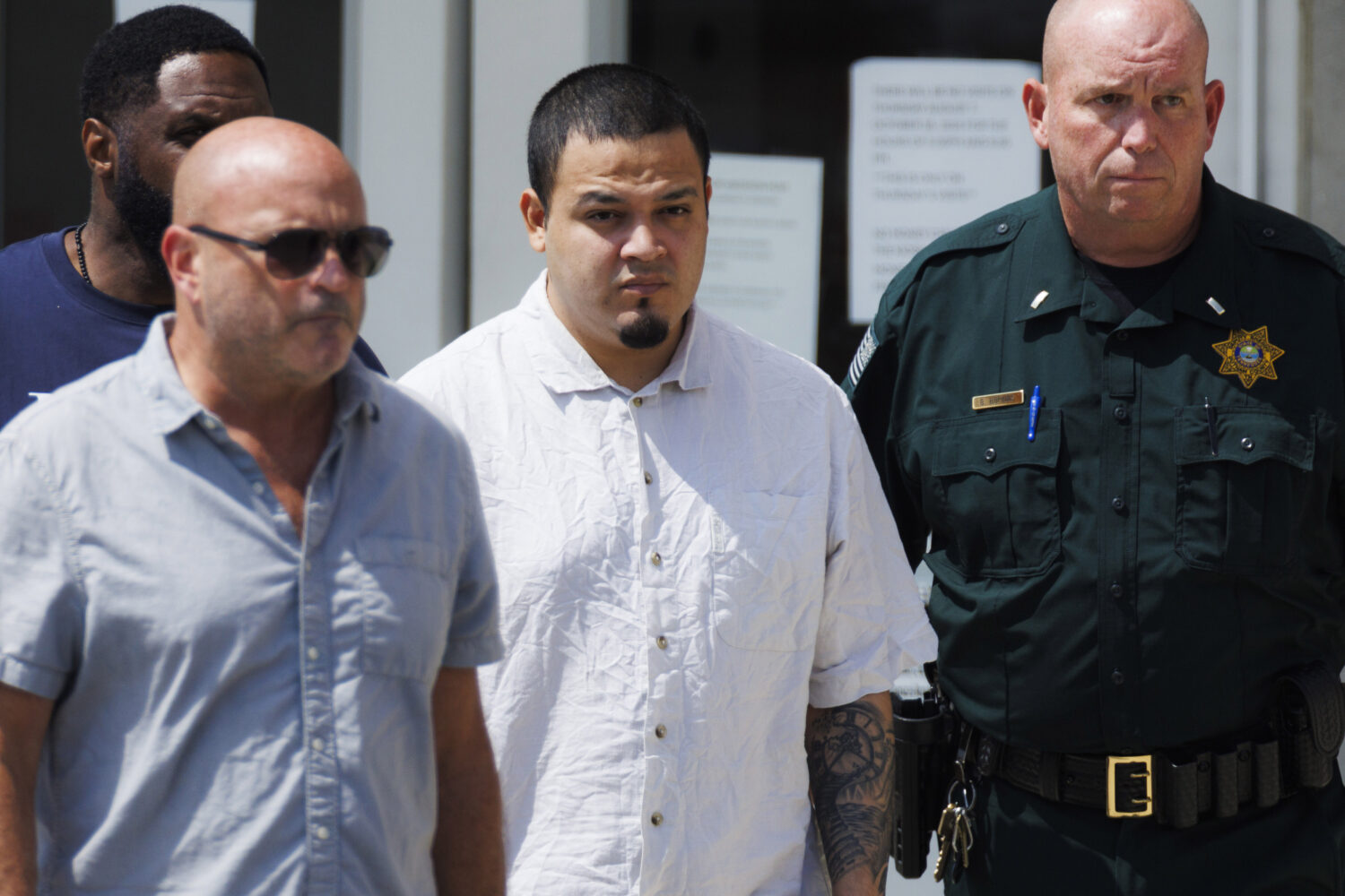 Kilmar Abrego Garcia, center, leaves the Putnam County Jail, Friday, Aug. 22, 2025, in Cookeville, ...