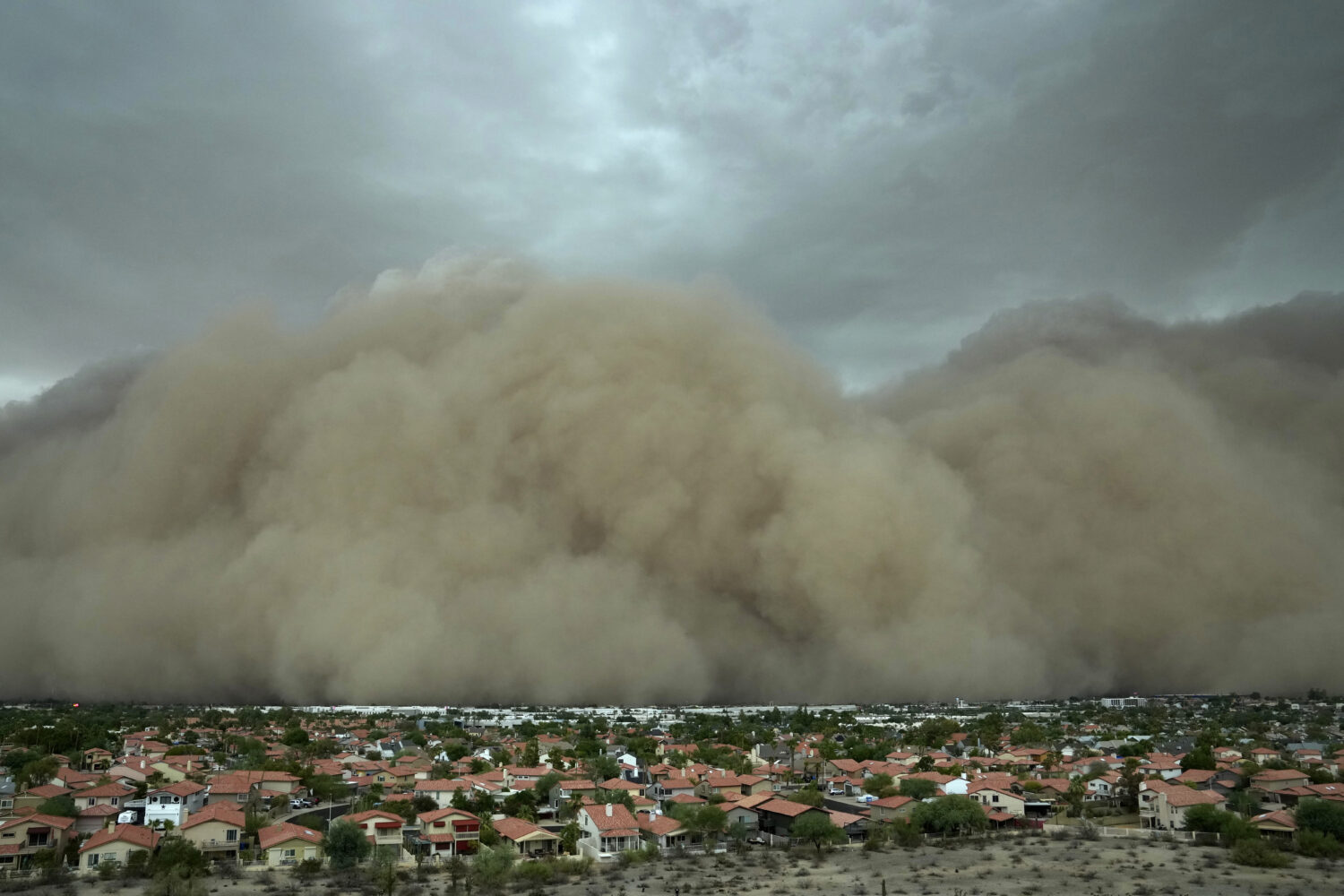 A giant dust storm approaches the Phoenix metro area as a monsoon storm pushes the dust into the ai...