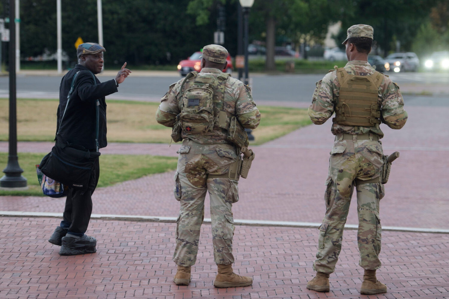 Armed members of the South Carolina National Guard talk with a man while positioned outside of Unio...