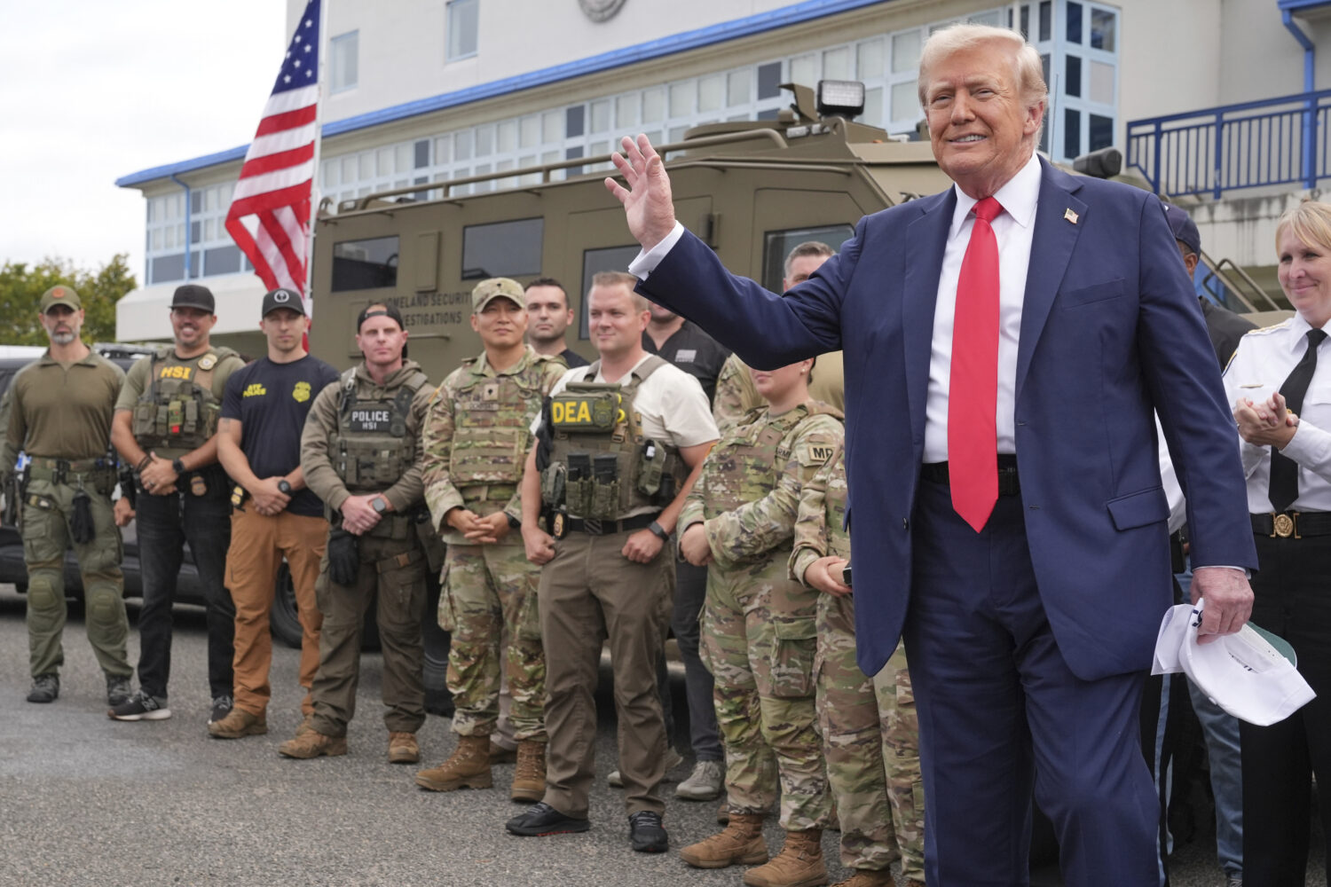 President Donald Trump speaks with members of law enforcement and National Guard soldiers, Thursday...