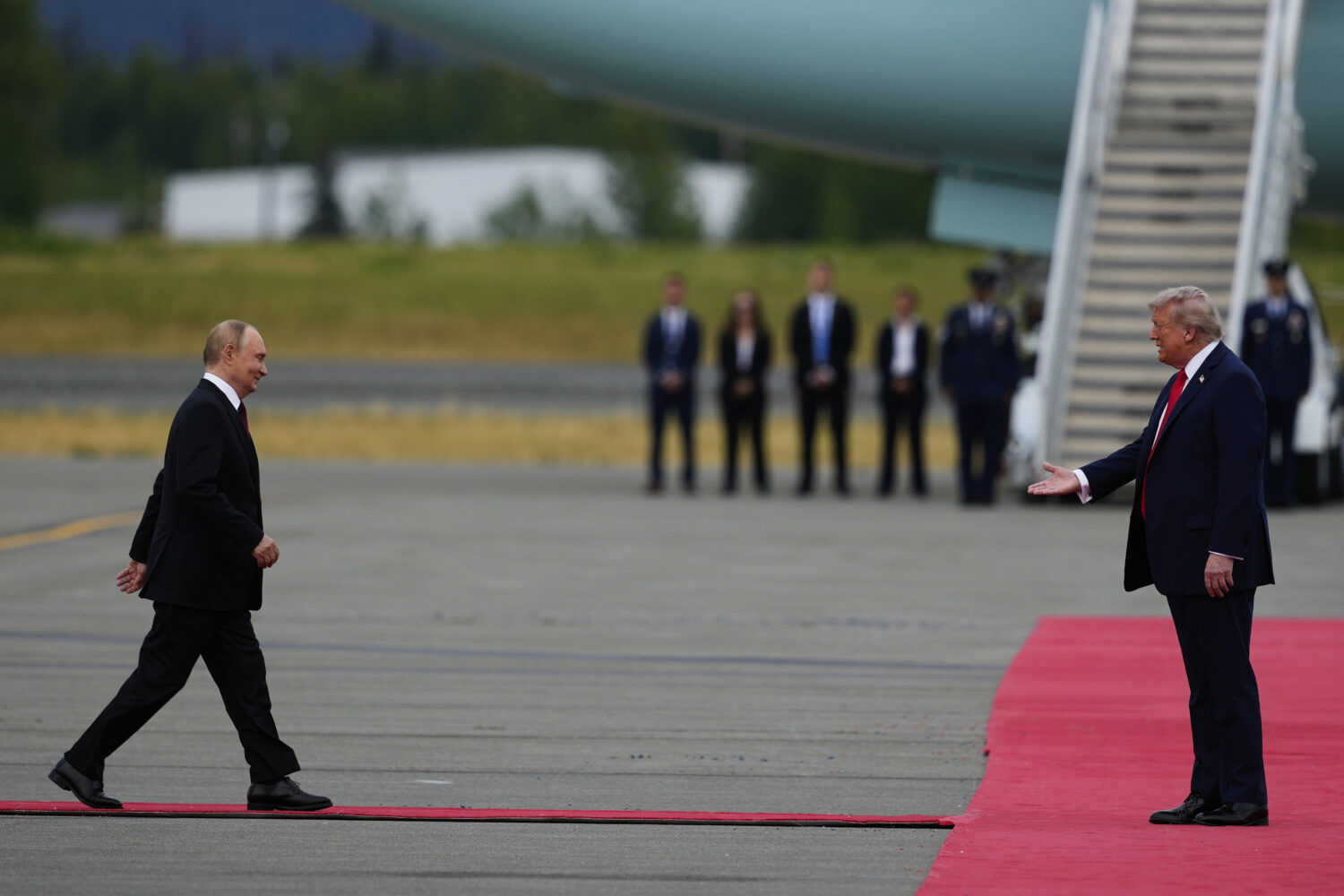 President Donald Trump greets Russia's President Vladimir Putin Friday, Aug. 15, 2025, at Joint Bas...