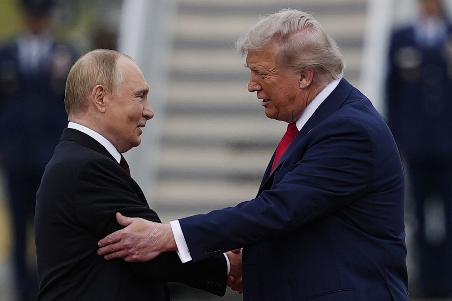 President Donald Trump greets Russia's President Vladimir Putin Friday, Aug. 15, 2025, at Joint Bas...